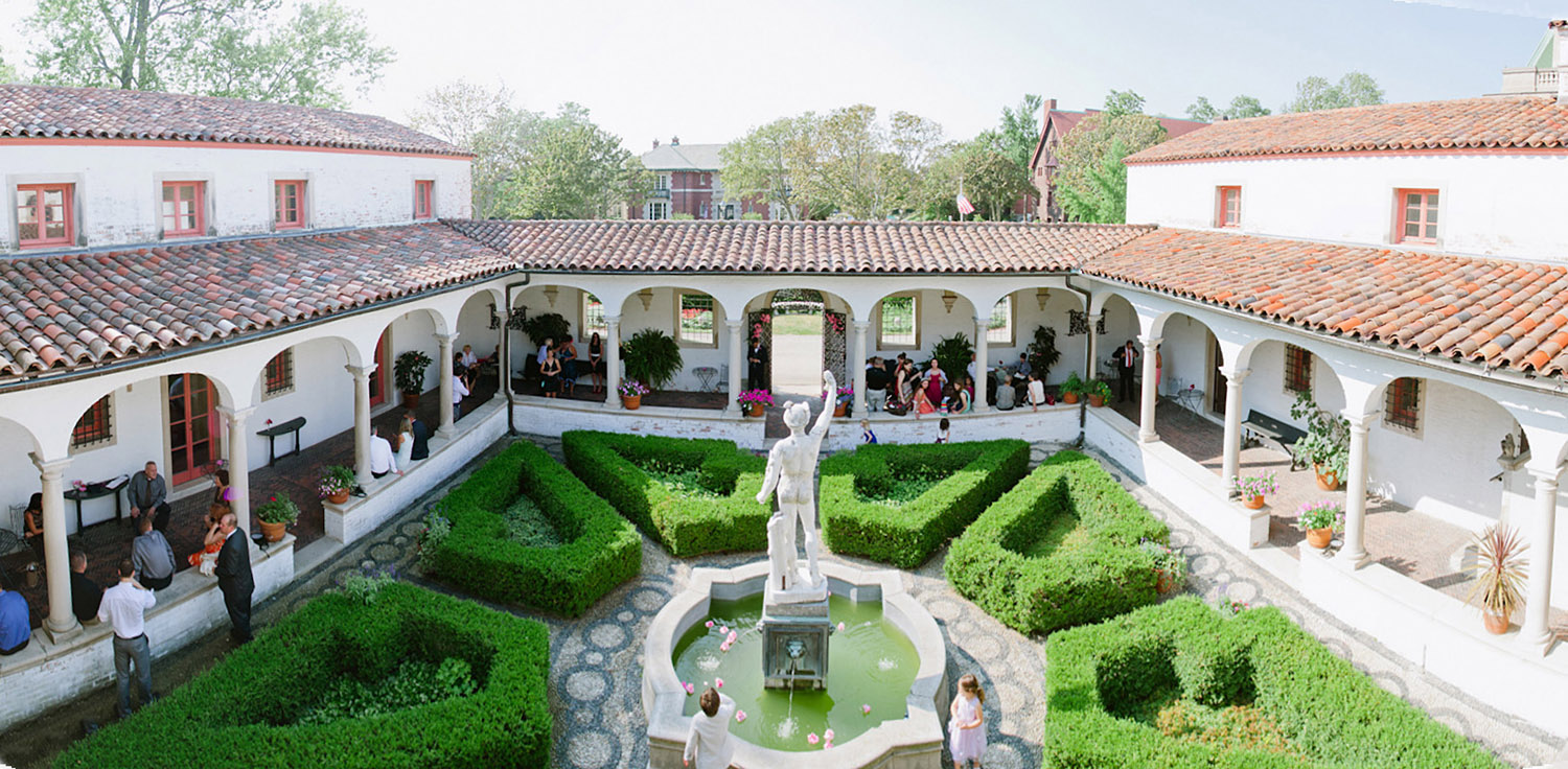 panoramic image of the italian destination wedding at the Villa Terrace in milwaukee by International Destination Wedding photographer Lexia Frank who is a film photographer for luxury weddings