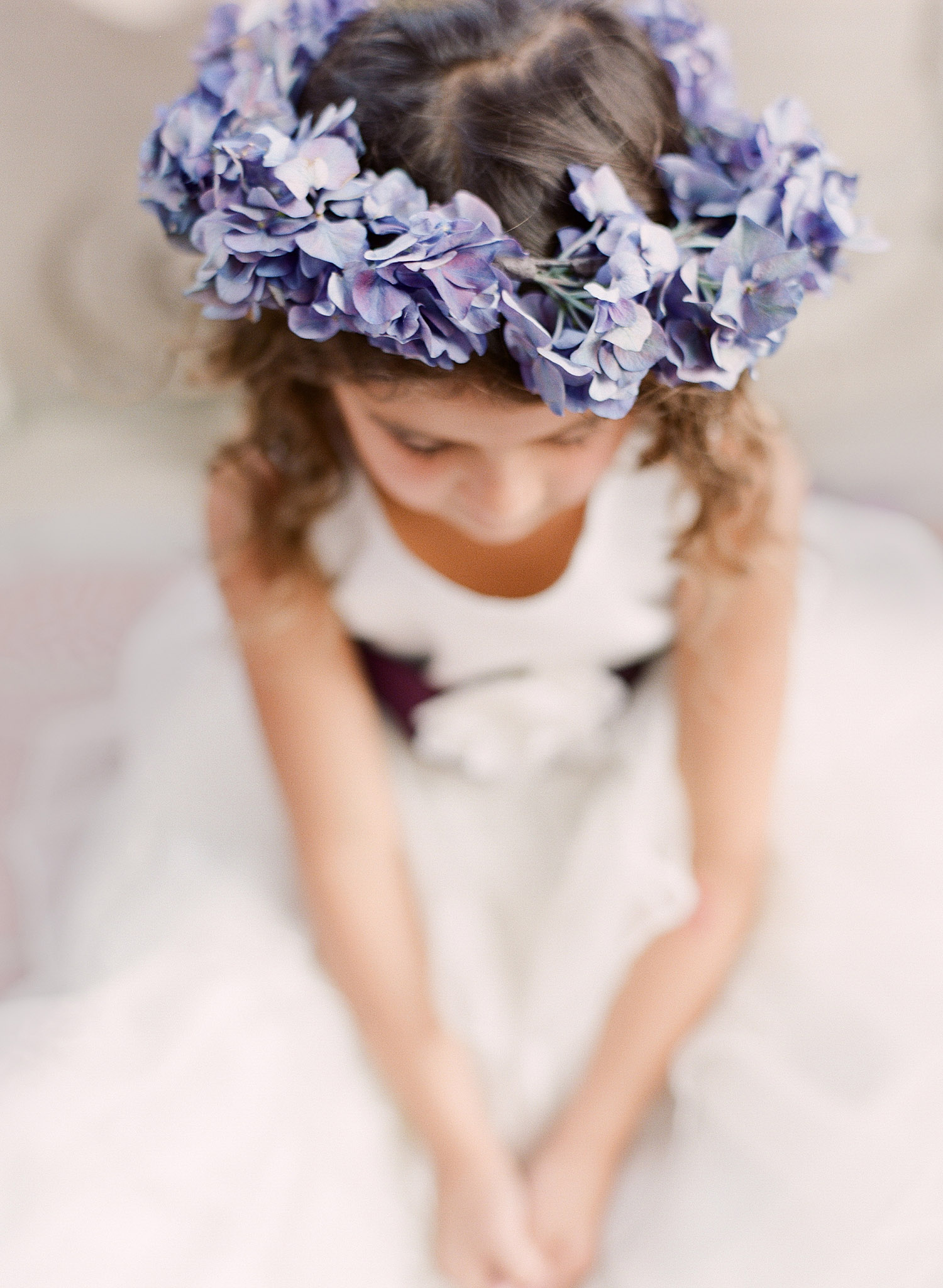 a hydrangea crown of flowers for the flower girl is beautiful at this Destination Italian Wedding at the Villa Terrace- a lovely wedding venue where Destination Wedding Photographer Lexia Frank loves to shoot film for her luxury weddings