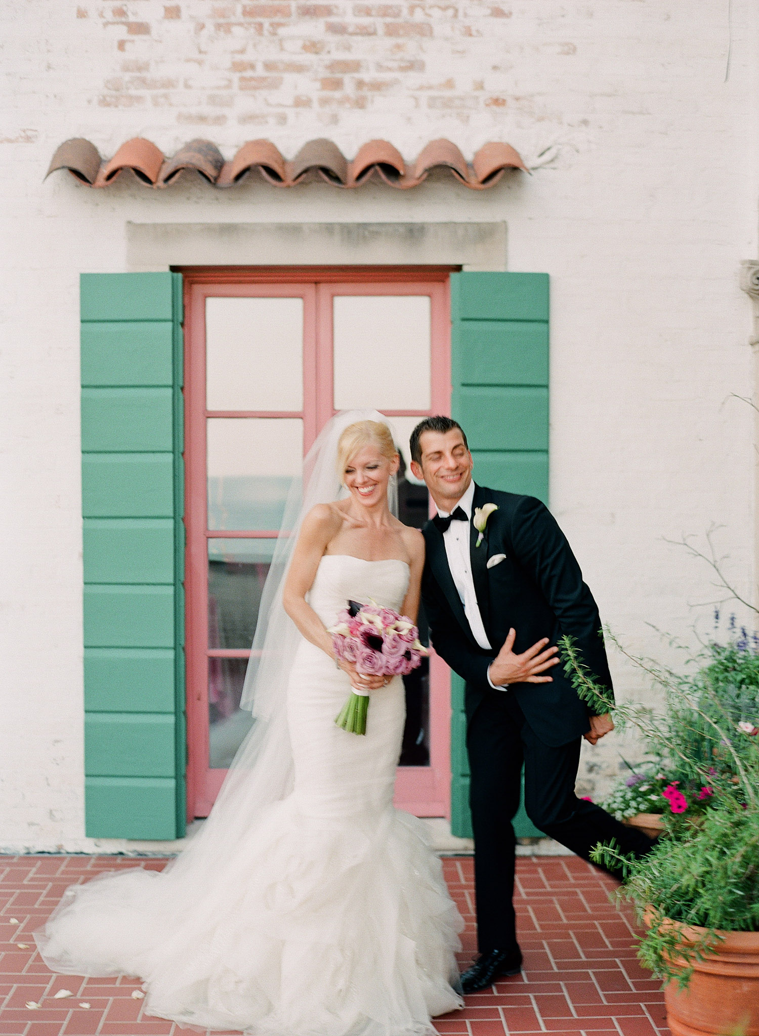 bride and groom pose at their Destination Italian Wedding at the Villa Terrace, a favorite Italian Wedding venue of Destination wedding photographer Lexia Frank, who is a film photographer for luxury weddings