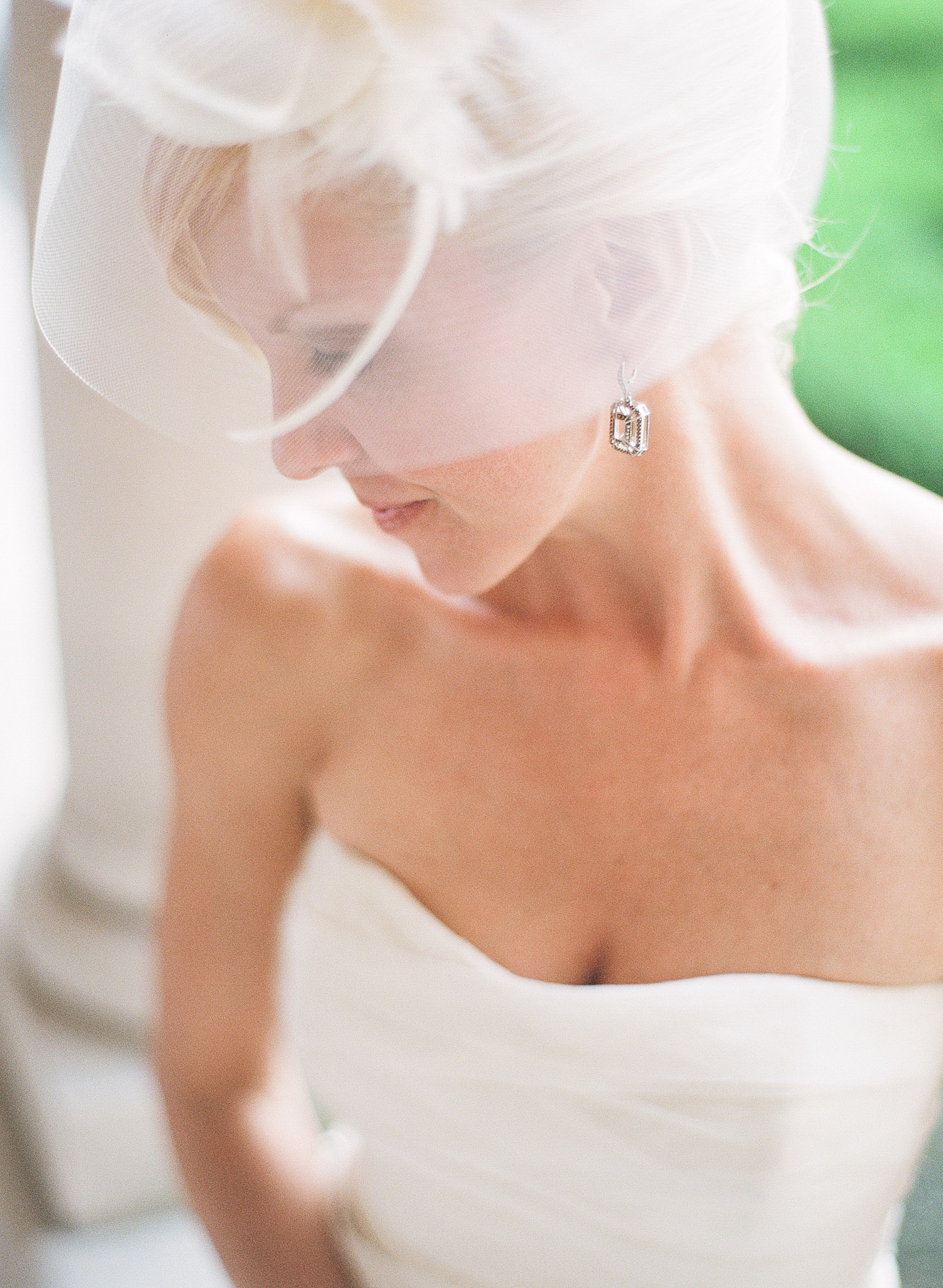 wedding hat on a bride at an italian wedding at The Villa Terrace photographed by Lexia Frank photography, film photographer who shoots luxury destination weddings