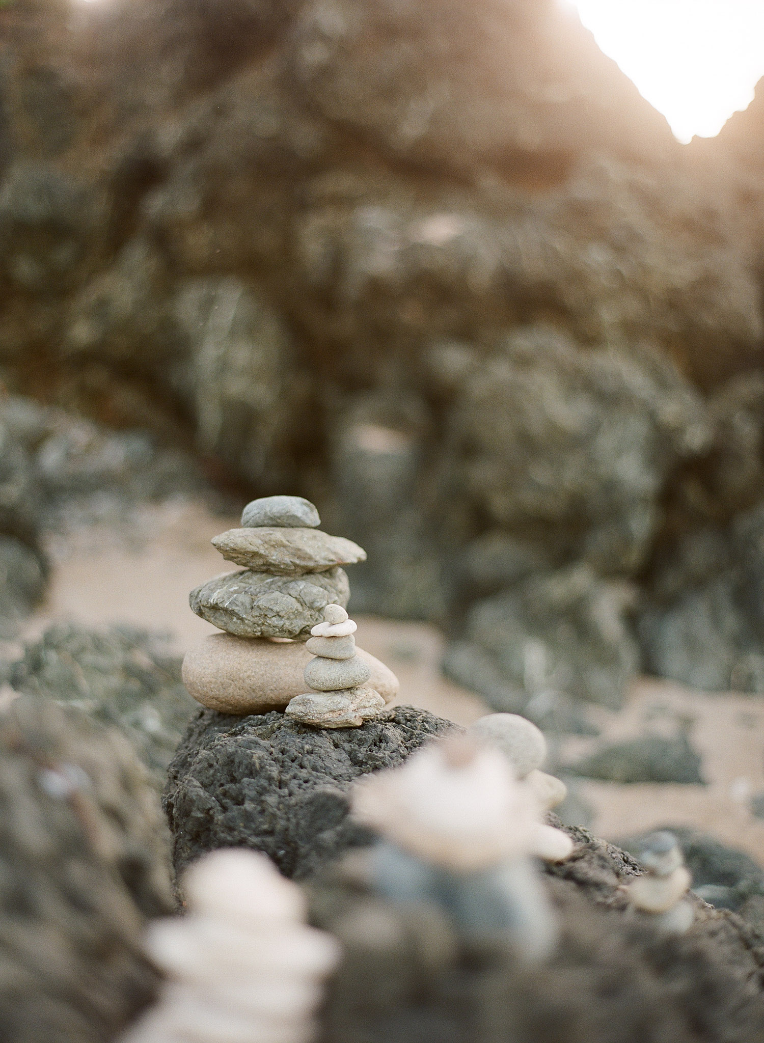 stones are stacked on the beach at Vieques Island Puerto rico at this modern destination wedding at the W hotel on Vieques island puerto rico- while Destination wedding photographer Lexia Frank photographs this wedding on film 