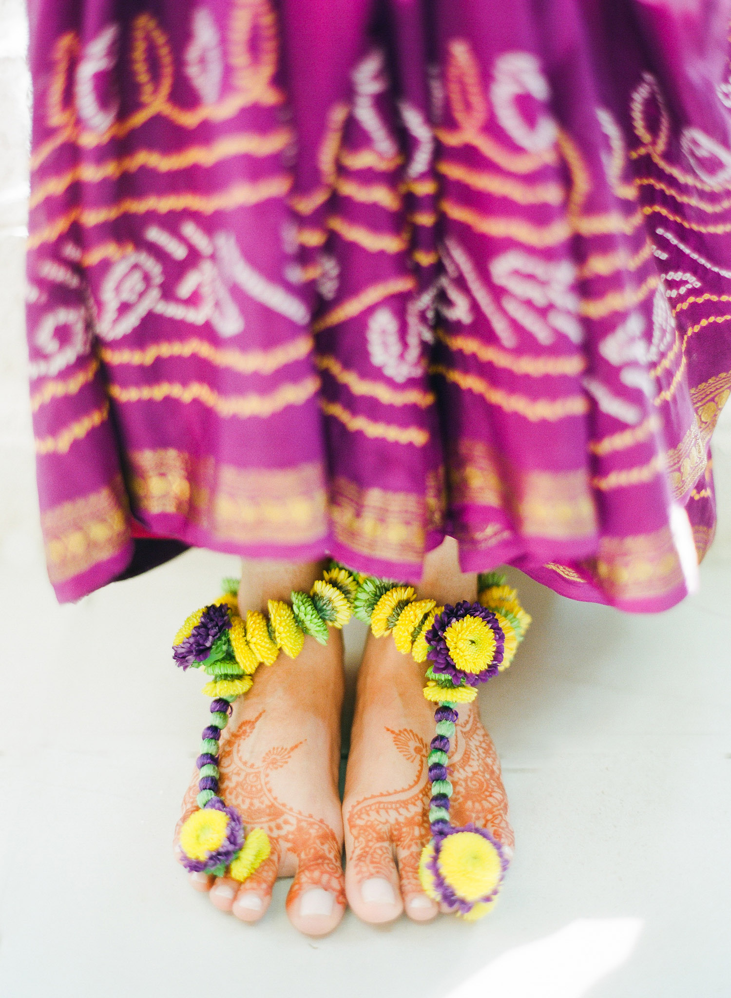 foot jewelry for this indian wedding is actually made of flowers- a floral indian anklet - for this hindu wedding in palm coast florida at the hammock beach resort photographed by Destination Wedding photographer Lexia Frank, a top indian wedding photographer who shoots film for weddings with medium format cameras for her luxury indian weddings worldwide 