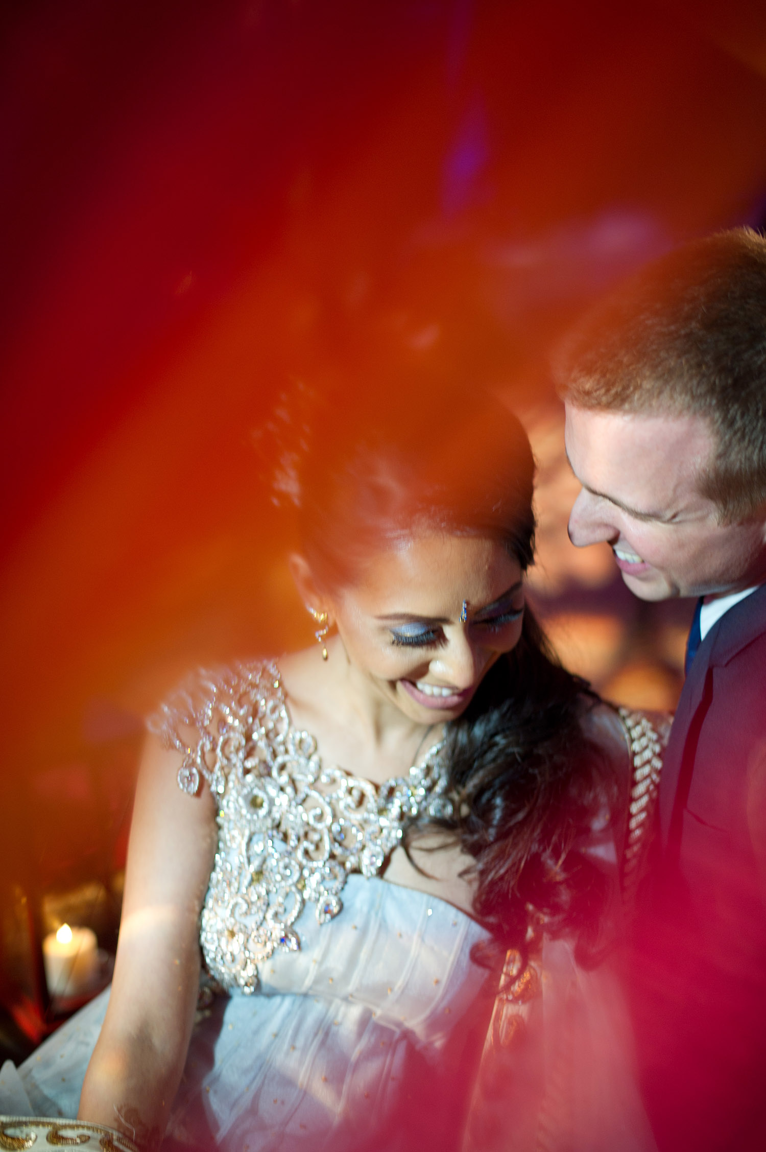 this beautiful indian bride and groom share a moment during their hindu wedding reception while destination wedding photographer Lexia Frank, ranked top indian wedding photographer, photographs their wedding on film because she is a film photographer for luxury indian weddings in India, Florida and worldwide. her brides love south asian bride magazine, maharani weddings, suneet varma and manish malhotra 