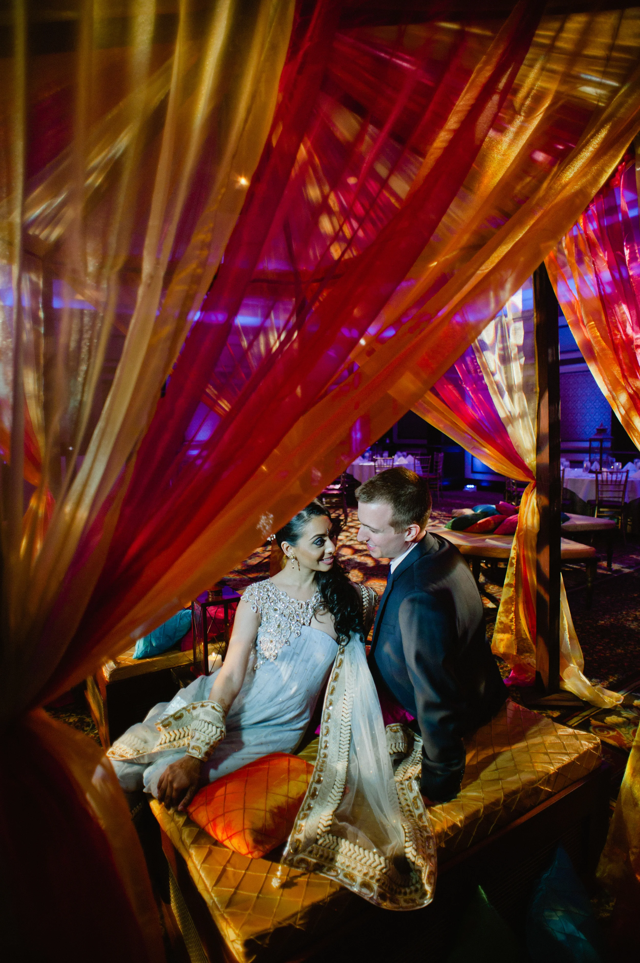 bride and groom take a moment to themselves during the hindu wedding reception at vizcaya museum and gardens in florida where Destination Wedding Photographer Lexia Frank, a top indian wedding photographer, photographs their wedding on film because she she prefers the tonal ranges and quality of film for luxury indian weddings in india, miami and worldwide. her brides love maharani weddings, south asian bride magazine, suneet varma and manish malhotra 