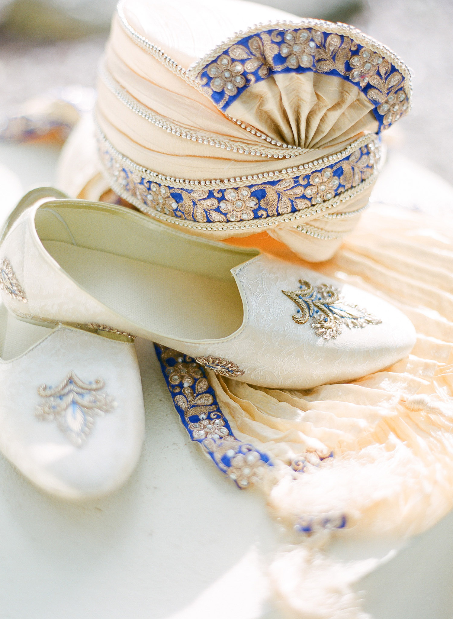 grooms attire for this hindu wedding , mojri turban Sherwani and a chudidar, while Destination wedding photographer Lexia Frank - a top indian wedding photographer for luxury indian weddings- photographs this luxury indian wedding in florida on film as she prefers the soft skin tones and vibrant colors for indian weddings in india and worldwide. manish malhotra suneet varna 