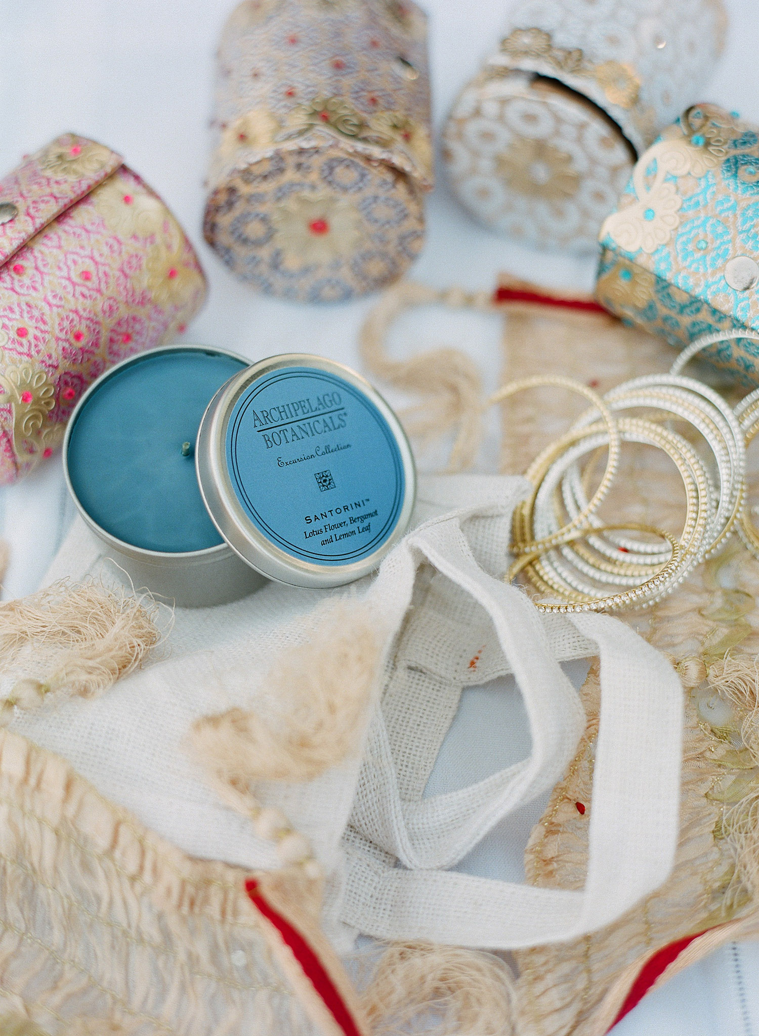 this indian bride gave bangles and candles to her wedding guests as favors for her luxury indian wedding photographed by Celebrity and Destination WEdding Photographer Lexia Frank, a top indian wedding photographer for luxury indian weddings in india and beyond. she prefers to shoot film for her indian weddings setting her apart from the typical digital photographer 