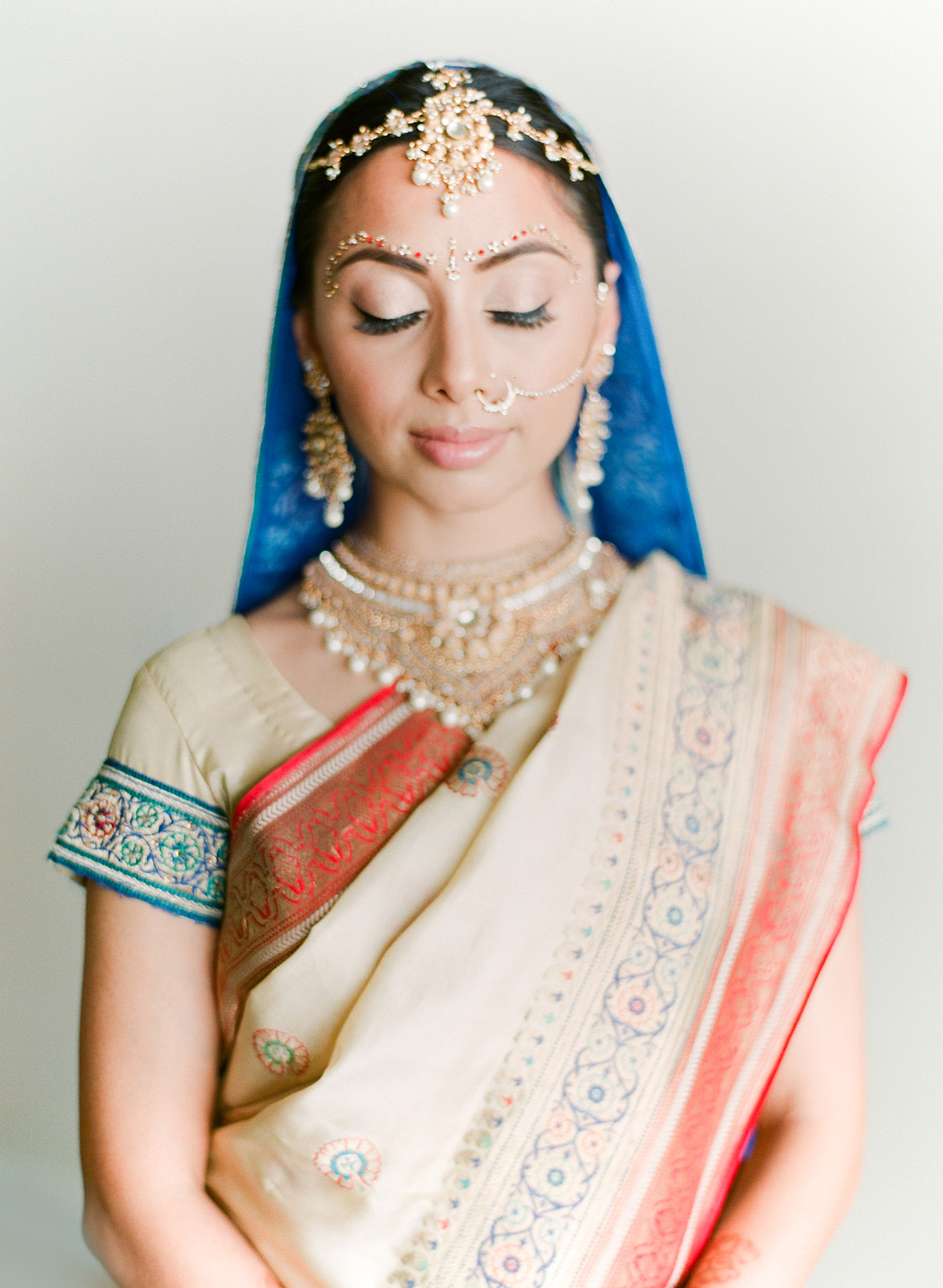 destination indian wedding photographer, Lexia Frank, a top indian wedding photographer for luxury indian weddings, photographs this hindu bride wearing her mother's vintage saree on film as she is a film photographer for indian weddings because she prefers the beautiful skin tones and vibrant colors for indian weddings in india and worldwide. manish malhotra and suneet varna 