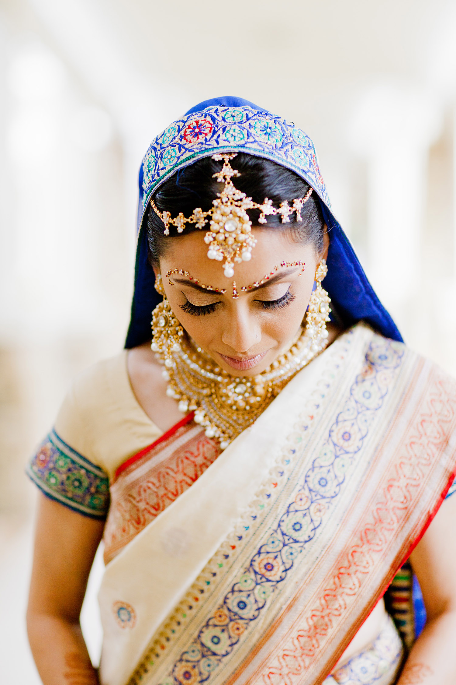 Hindu bride during her indian wedding wearing her mother's saree photographed by Destination wedding photographer LExia Frank, a top indian wedding photographer for luxury indian weddings, photographs this luxury indian wedding on film because she prefers film photography for indian weddings because of the vibrant colors of film 