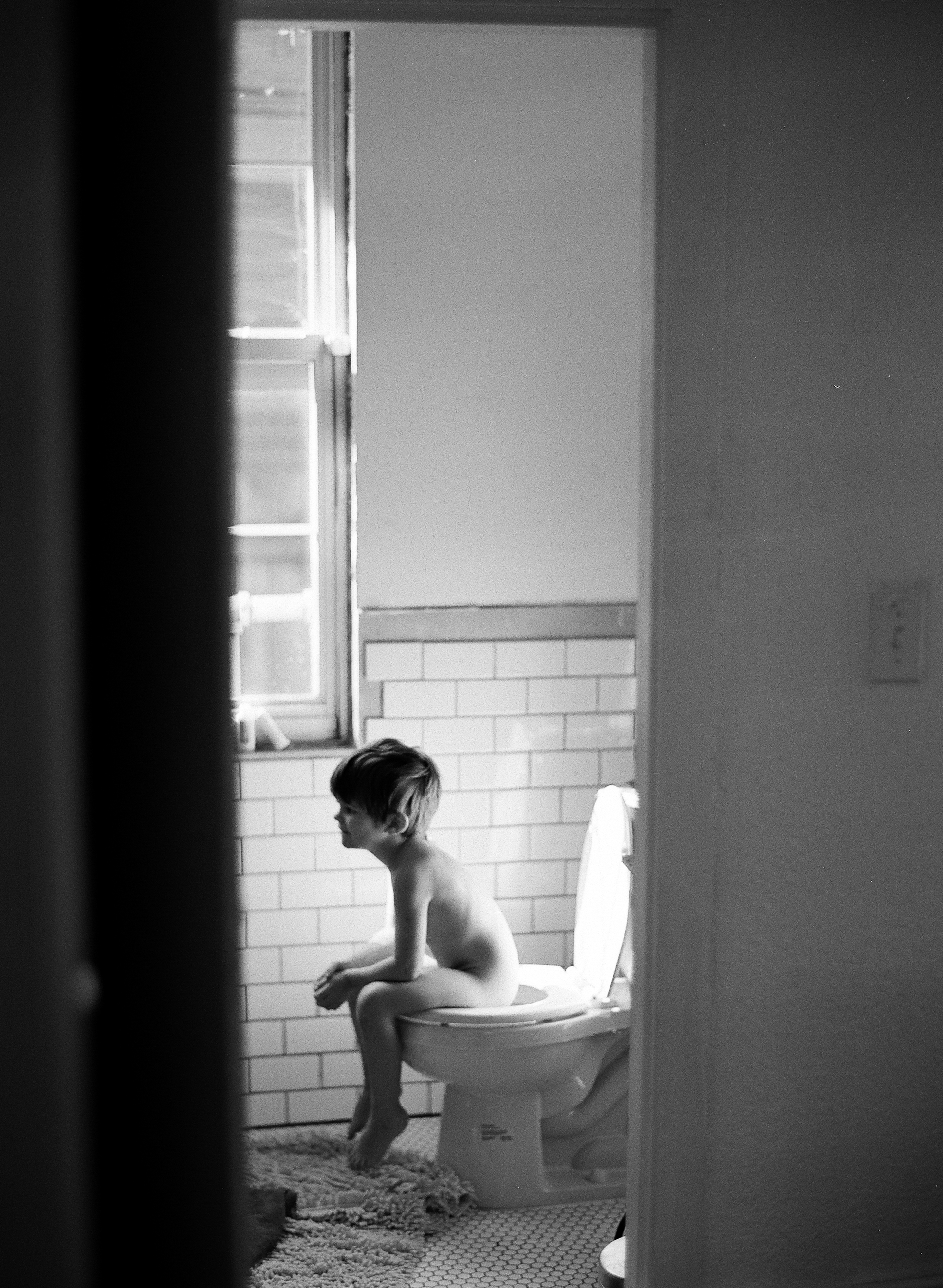 Portland Oregon Film Photographer, Lexia Frank, photographs a documentary family session in portland oregon on black and white film 