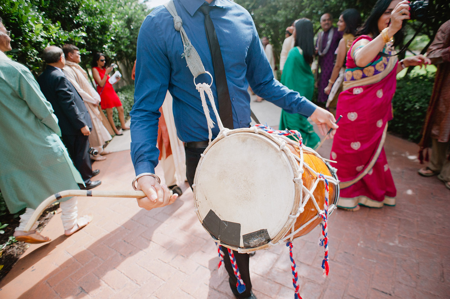 drummer at this hindu wedding ceremony in Palm Coast Florida where Destination wedding photographer Lexia Frank, a top indian wedding photographer, photographs this luxury indian wedding on film - preferring the soft skin tones and vibrant colors of film for indian weddings