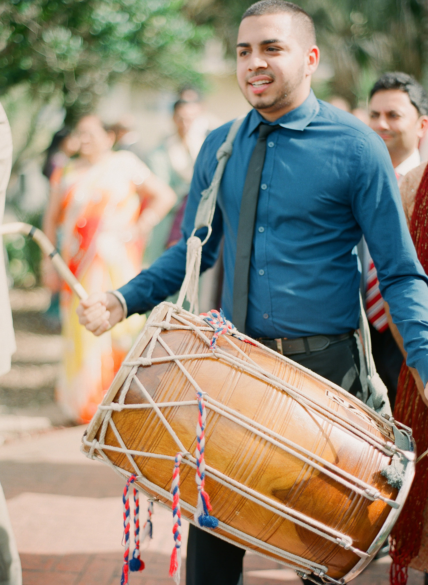 drummer creates a beat for the groom's parade at this Indian Wedding in Florida photographed by Destination Wedding Photographer, LExia Frank - a top indian wedding photographer - who shoots film for luxury indian weddings preferring the soft skin tones and vibrant colors for indian weddings in india and worldwide