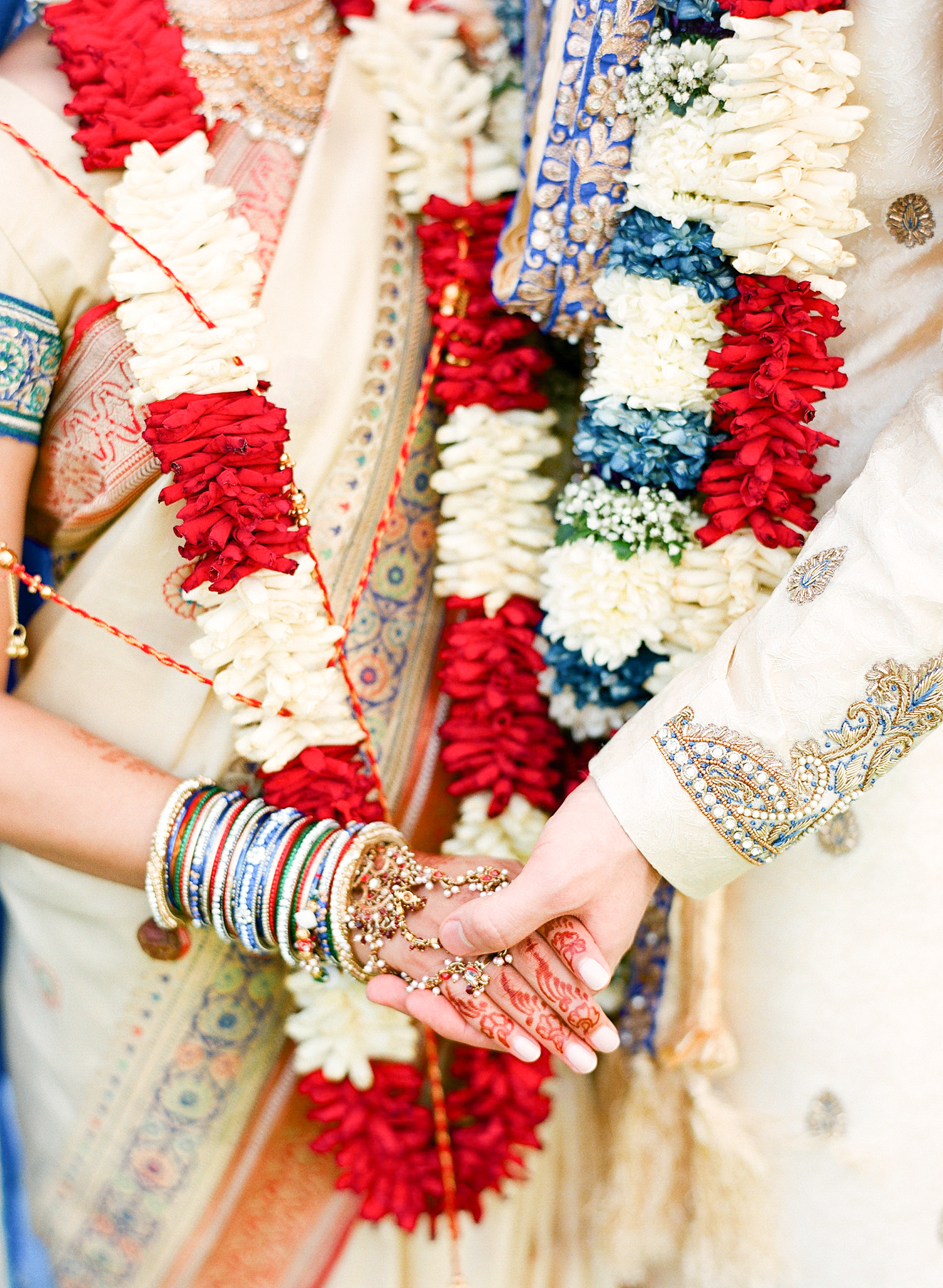 hindu bride and groom hold hands during their Indian Wedding in Florida photographed by Destination Wedding Photographer, LExia Frank - a top indian wedding photographer - who shoots film for luxury indian weddings preferring the soft skin tones and vibrant colors for indian weddings in india and worldwide
