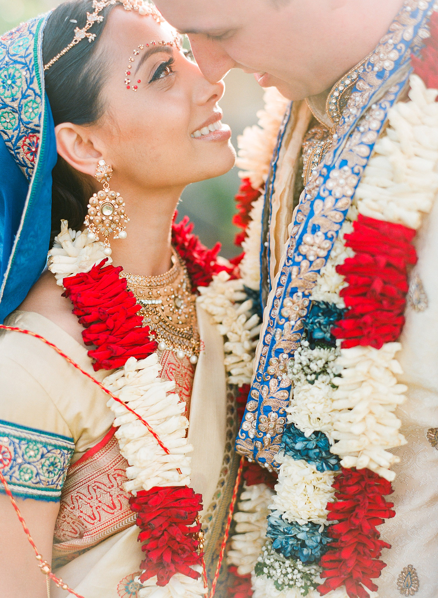 bride and groom after the ceremony at this Indian Wedding in Florida photographed by Destination Wedding Photographer, LExia Frank - a top indian wedding photographer - who shoots film for luxury indian weddings preferring the soft skin tones and vibrant colors for indian weddings in india and worldwide