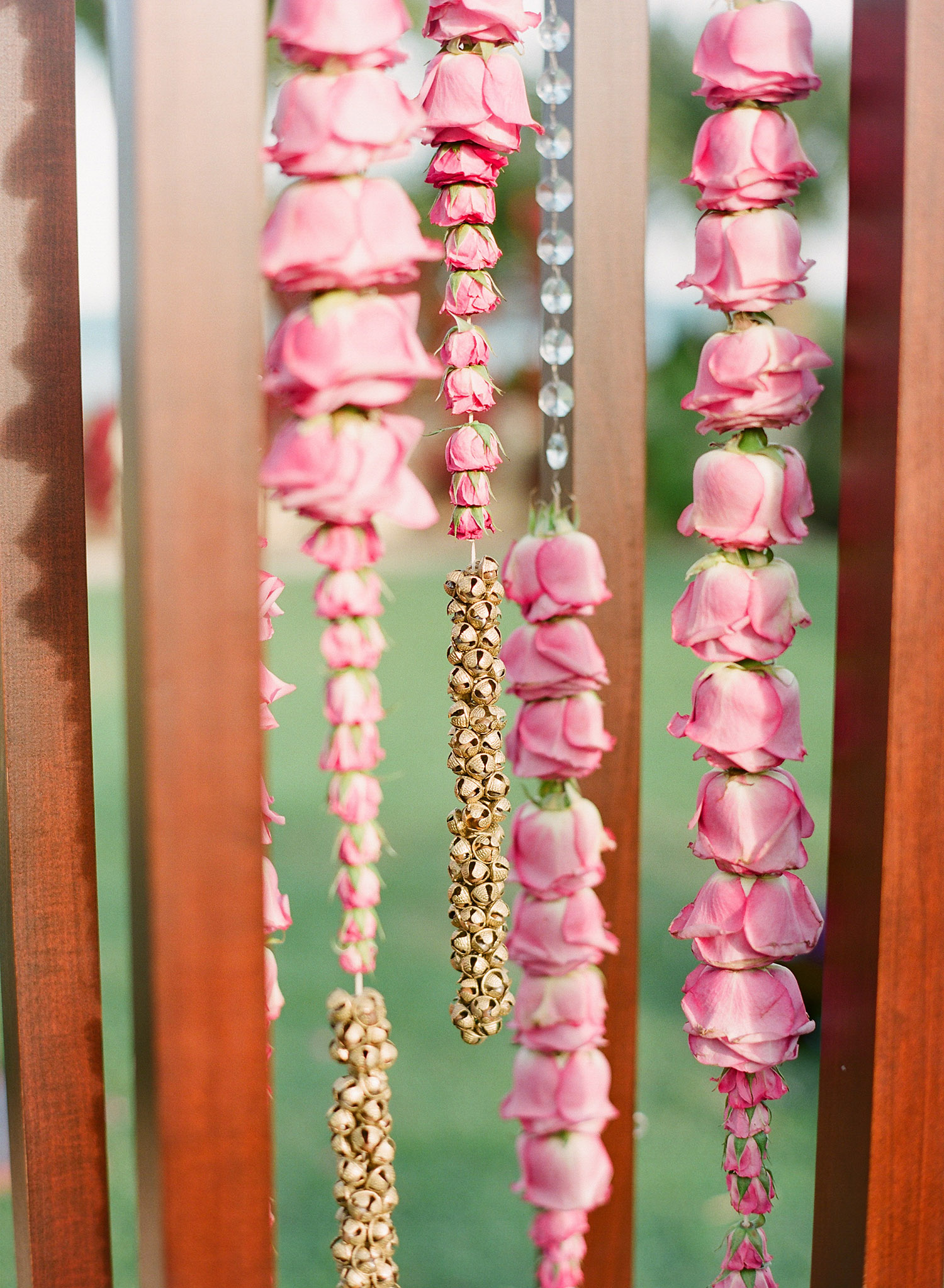 detail of the mandap with cascading flowers and indian ankle bells traditionally used for dancing at this Indian Wedding in Florida photographed by Destination Wedding Photographer, LExia Frank - a top indian wedding photographer - who shoots film for luxury indian weddings preferring the soft skin tones and vibrant colors for indian weddings in india and worldwide