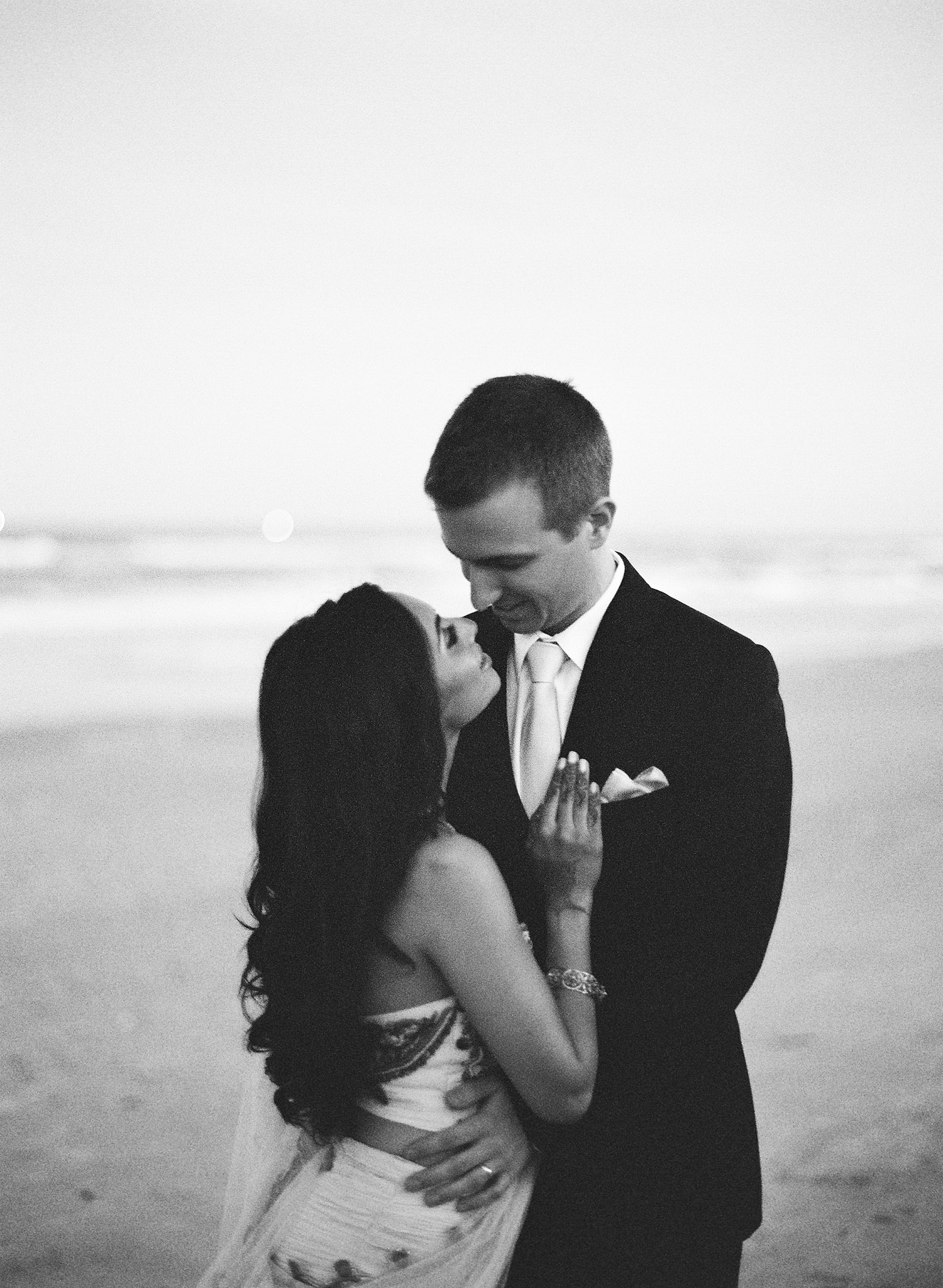 indian bride wears a pink and gold wedding lengha for her indian wedding in florida on the beach in palm coast florida as Destination Wedding Photographer Lexia Frank - an award winning indian wedding photographer - photographs her indian wedding on film, as she is a fine art wedding film photographer for destination weddings and luxury weddings worldwide. vizcaya miami wedding, hammock beach resort wedding. 
