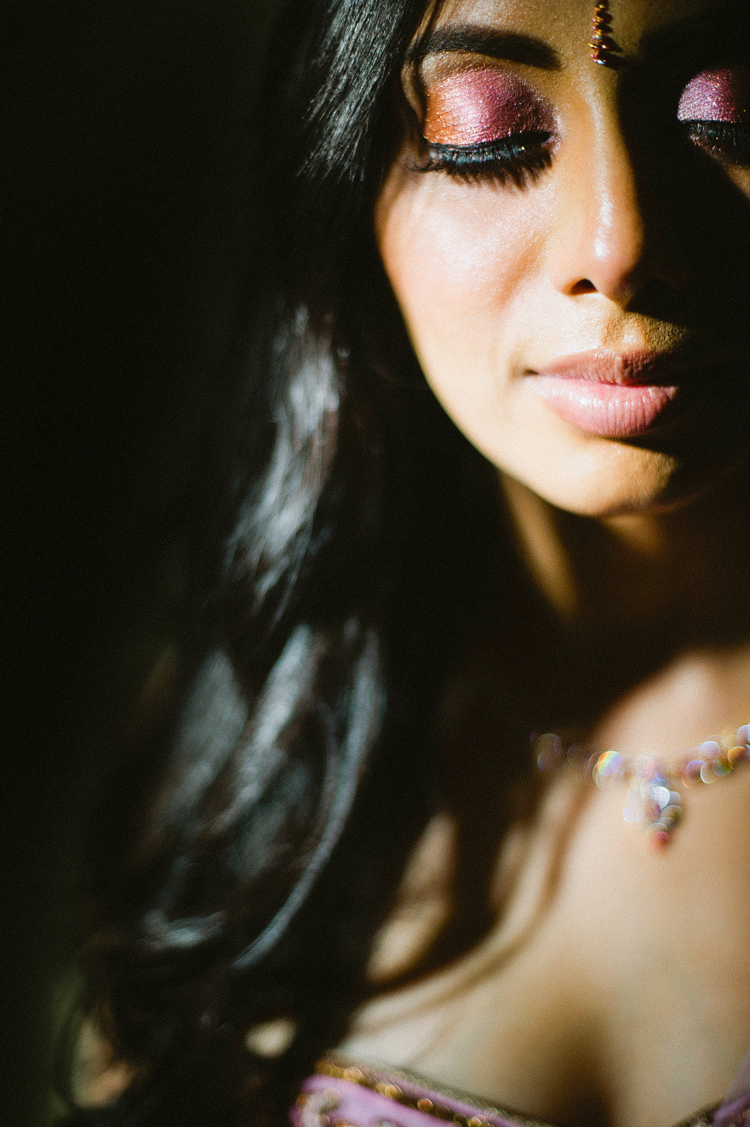 indian bride wears a pink and gold wedding lengha for her indian wedding in florida on the beach in palm coast florida as Destination Wedding Photographer Lexia Frank - an award winning indian wedding photographer - photographs her indian wedding on film, as she is a fine art wedding film photographer for destination weddings and luxury weddings worldwide. vizcaya miami wedding, hammock beach resort wedding