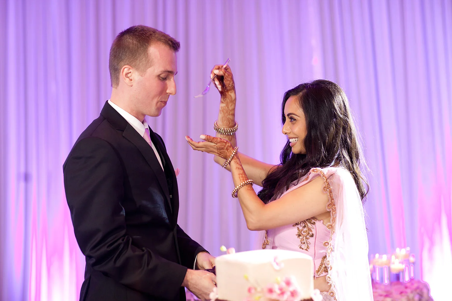 indian bride wears a pink and gold wedding lengha for her indian wedding in florida on the beach in palm coast florida as Destination Wedding Photographer Lexia Frank - an award winning indian wedding photographer - photographs her indian wedding on film, as she is a fine art wedding film photographer for destination weddings and luxury weddings worldwide. vizcaya miami wedding, hammock beach resort wedding