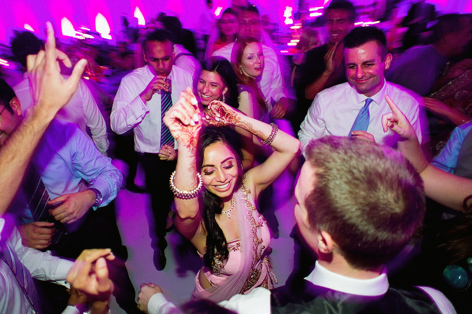 indian bride wears a pink and gold wedding lengha for her indian wedding in florida on the beach in palm coast florida as Destination Wedding Photographer Lexia Frank - an award winning indian wedding photographer - photographs her indian wedding on film, as she is a fine art wedding film photographer for destination weddings and luxury weddings worldwide. vizcaya miami wedding, hammock beach resort wedding