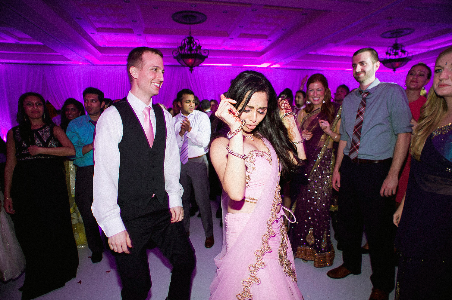 indian bride wears a pink and gold wedding lengha for her indian wedding in florida on the beach in palm coast florida as Destination Wedding Photographer Lexia Frank - an award winning indian wedding photographer - photographs her indian wedding on film, as she is a fine art wedding film photographer for destination weddings and luxury weddings worldwide. vizcaya miami wedding, hammock beach resort wedding