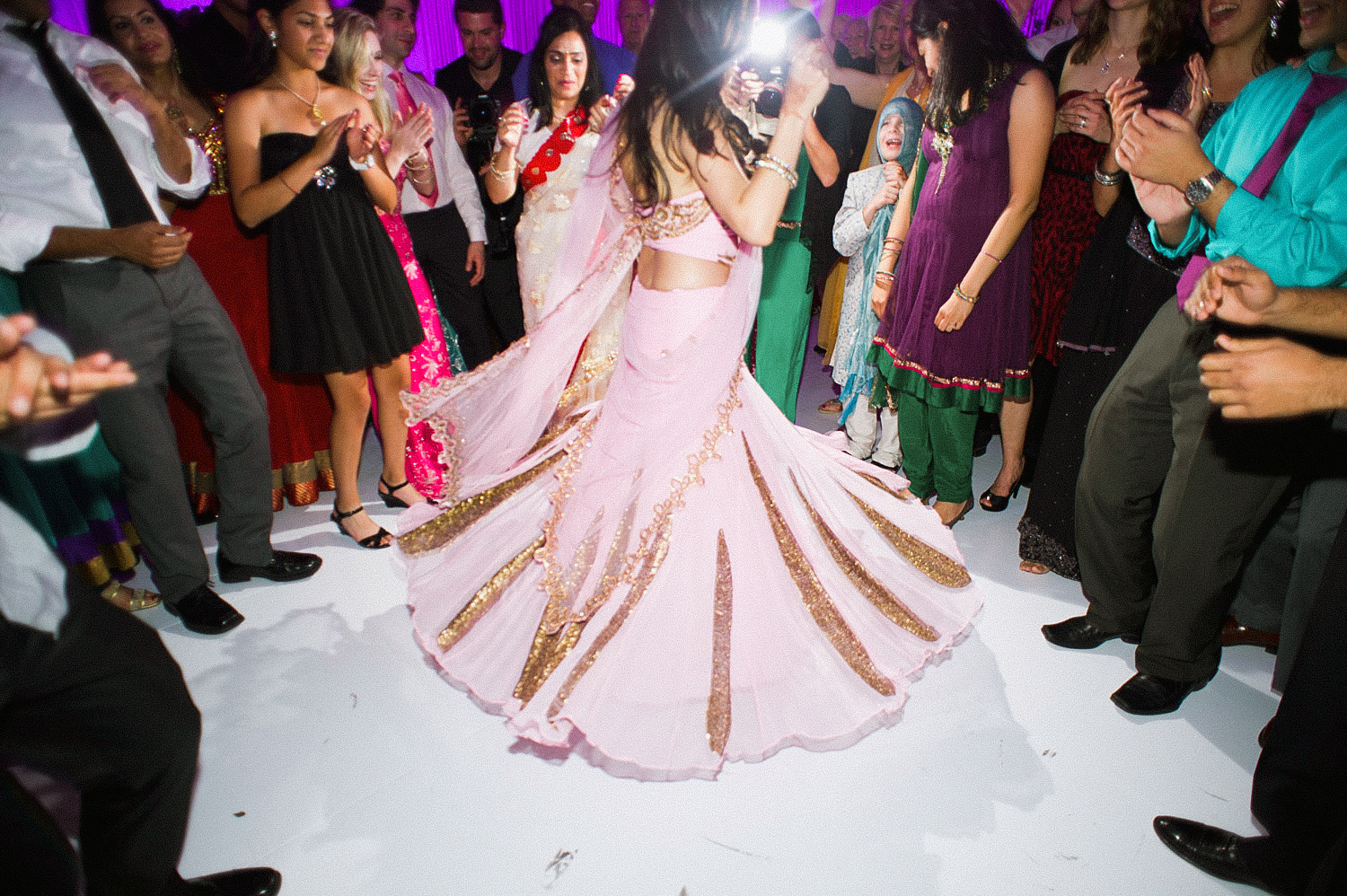 indian bride wears a pink and gold wedding lengha for her indian wedding in florida on the beach in palm coast florida as Destination Wedding Photographer Lexia Frank - an award winning indian wedding photographer - photographs her indian wedding on film, as she is a fine art wedding film photographer for destination weddings and luxury weddings worldwide. vizcaya miami wedding, hammock beach resort wedding