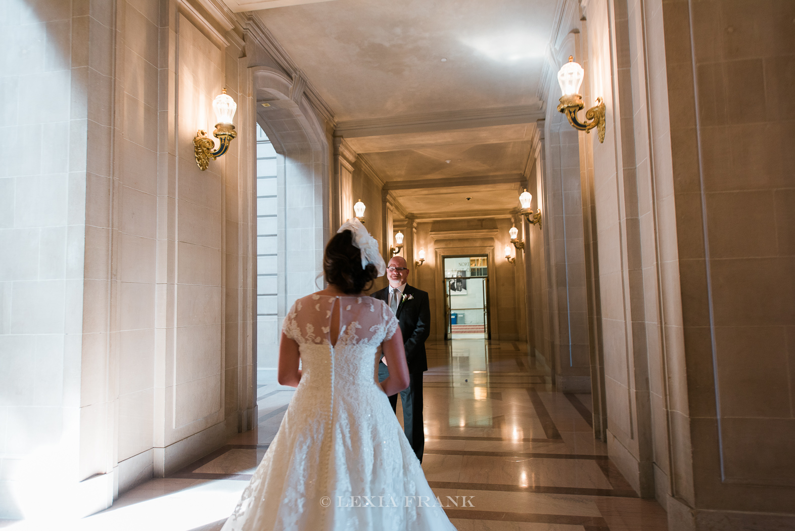 destination wedding photographer Lexia Frank - a portland oregon fine art film photographer - photographs this san francisco city hall wedding in sanfrancisco as bride and groom have their first look. www.lexiafrank.com 