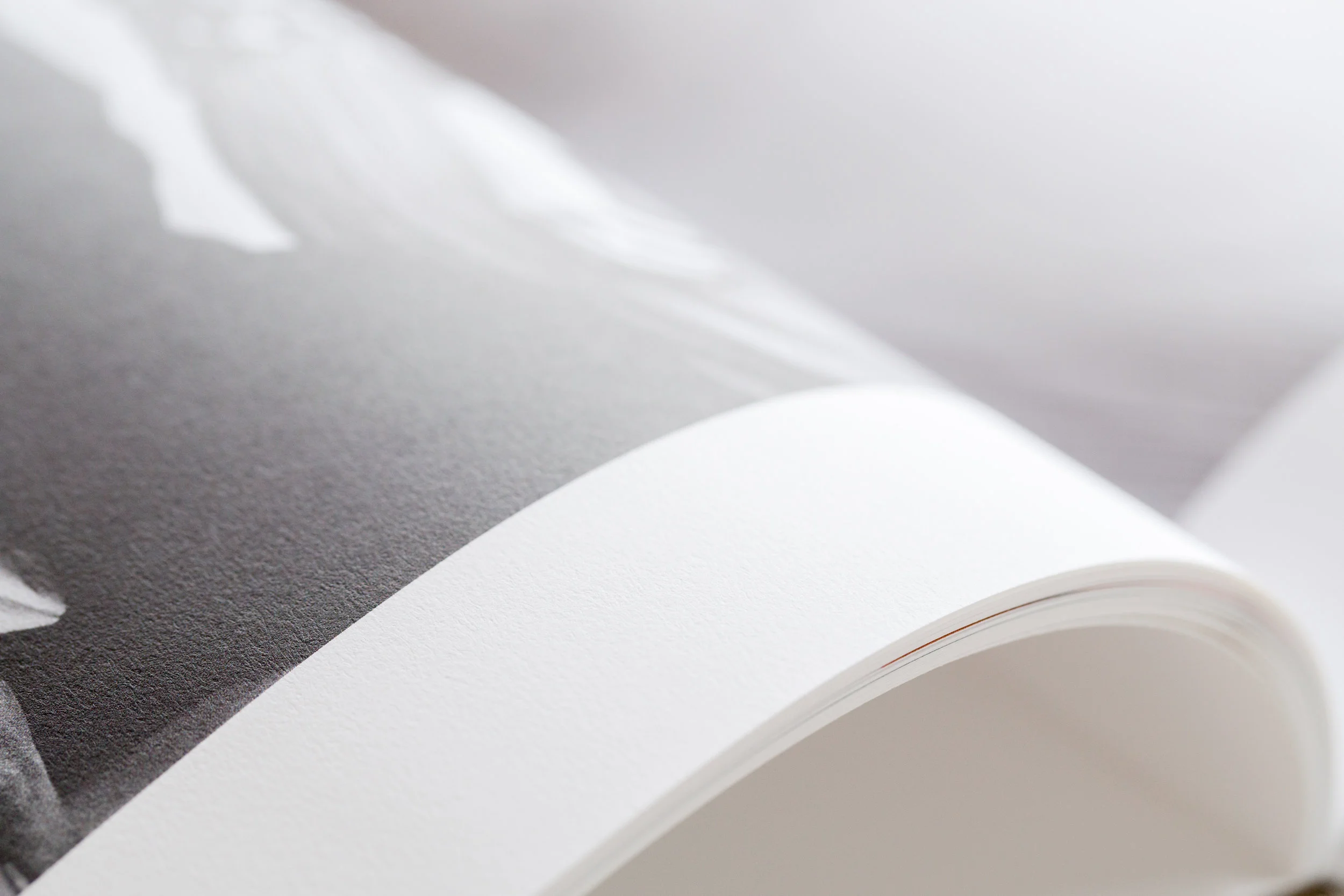 see how the pages fold over like a library book? this is the main difference between the Little Linen Book and our more substantial wedding albums. The pages are printed with a press printer with HD quality, but they are not actual photographic prints. The difference in quality, page type, and options available are what accounts for the price difference between the Little Linen Book and our more substantial wedding albums. 