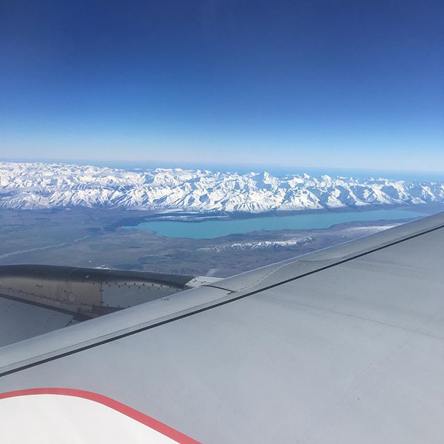Fresh dusting of snow on the southern alps & aerial shot of vineyards in Central Otago en route to Queenstown.