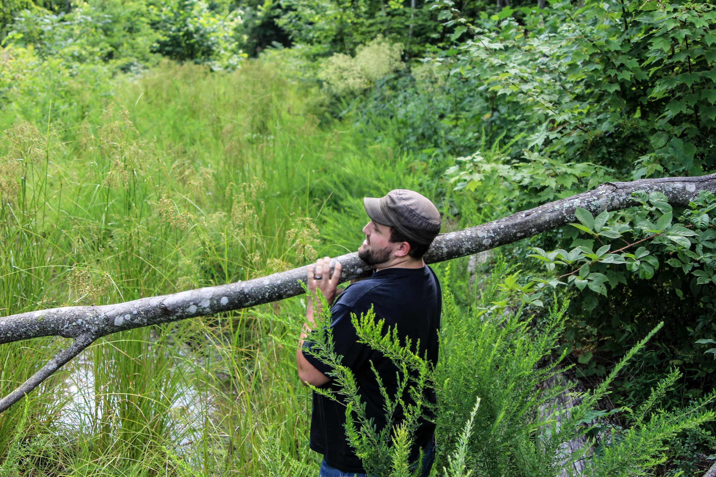 Kyle Clearing a trail of a fallen tree in Browns Fork, KY Photo by: Gerry Seavo 