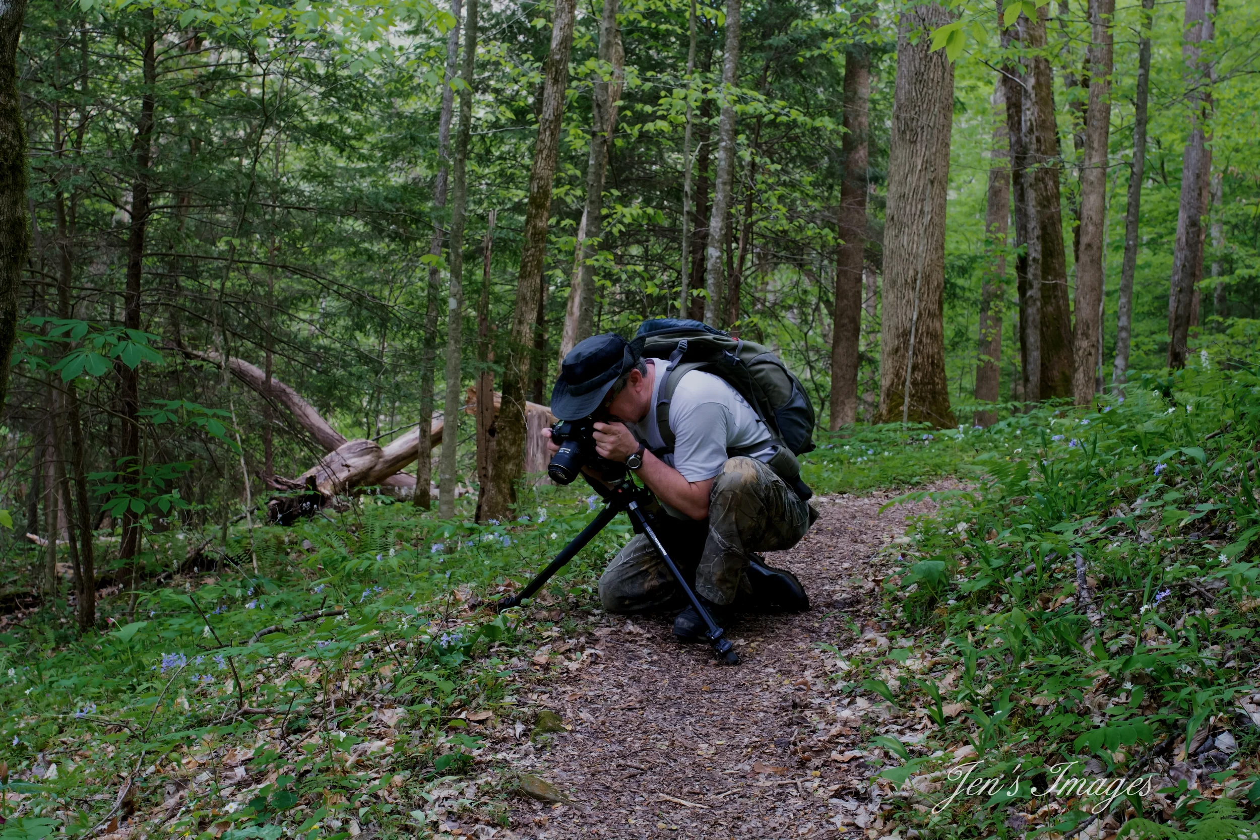 Jenny Davis' photo of husband Greg photographing wildflowers during the spring wildflower bloom at Yahoo Falls.