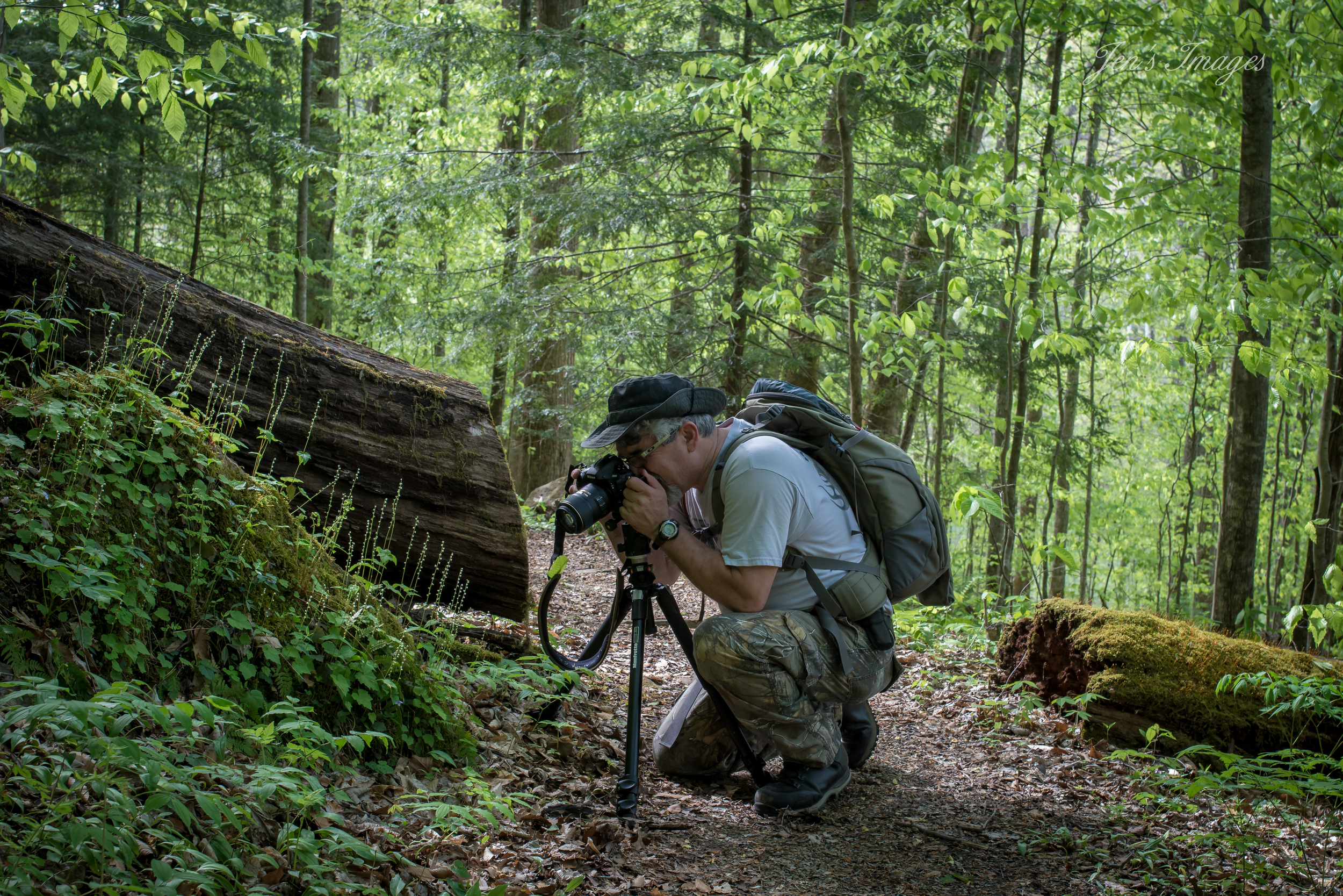 Jenny Davis' photo of husband Greg photographing wildflowers at Yahoo Falls.