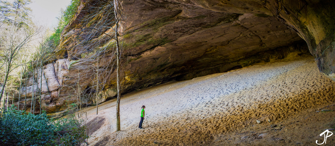 Lois Jean standing at the foot of Sand Cave.