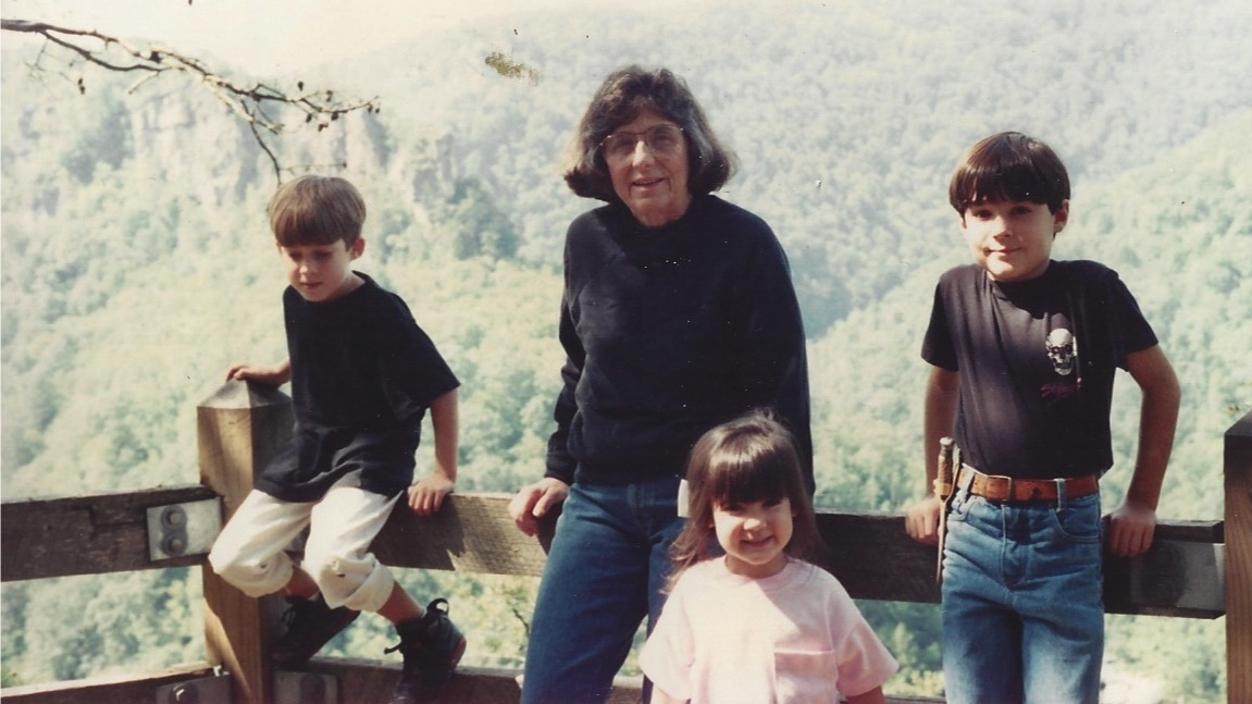 From the Schmidt Family Archives. Circa 1993. From left to right: the late Covie Schmidt, Kylie's middle brother, maternal grandmother, Grandma Lucy, Kylie, and Cole Schmidt, Kylie's oldest brother. Don't let the pink bow and shirt (didn't get the all black memo) fool you. All she's thinking about is climbing the Towers in the background...and not rubbing Cole the wrong way ("That's not a knife. This is a knife.").