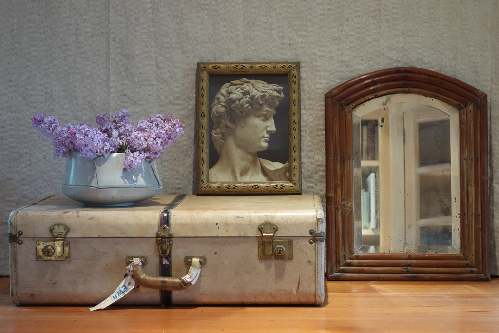 still life with suitcase and lilacs