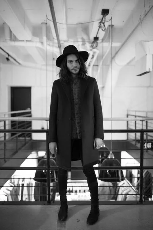 Maxwell wears Steven Alan scuba coat and Engineered Garments Boyle cardigan.