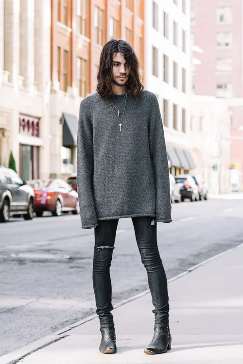 Maxwell wears Mollusk fisherman's sweater and Fail jewelry.