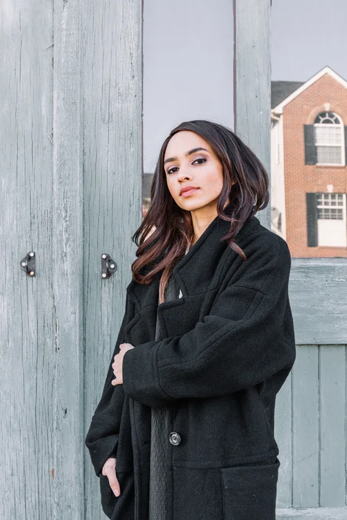 Rosa wears Black Crane quilted dress, Apiece Apart oversized Vida coat, Rachel Comey shoes and TiroTiro necklace.
