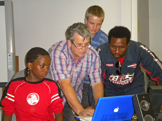 Kenneth, Danny, Mark and Derrick fine tuning the Mac for Garageband Demo (Photo C. Street)