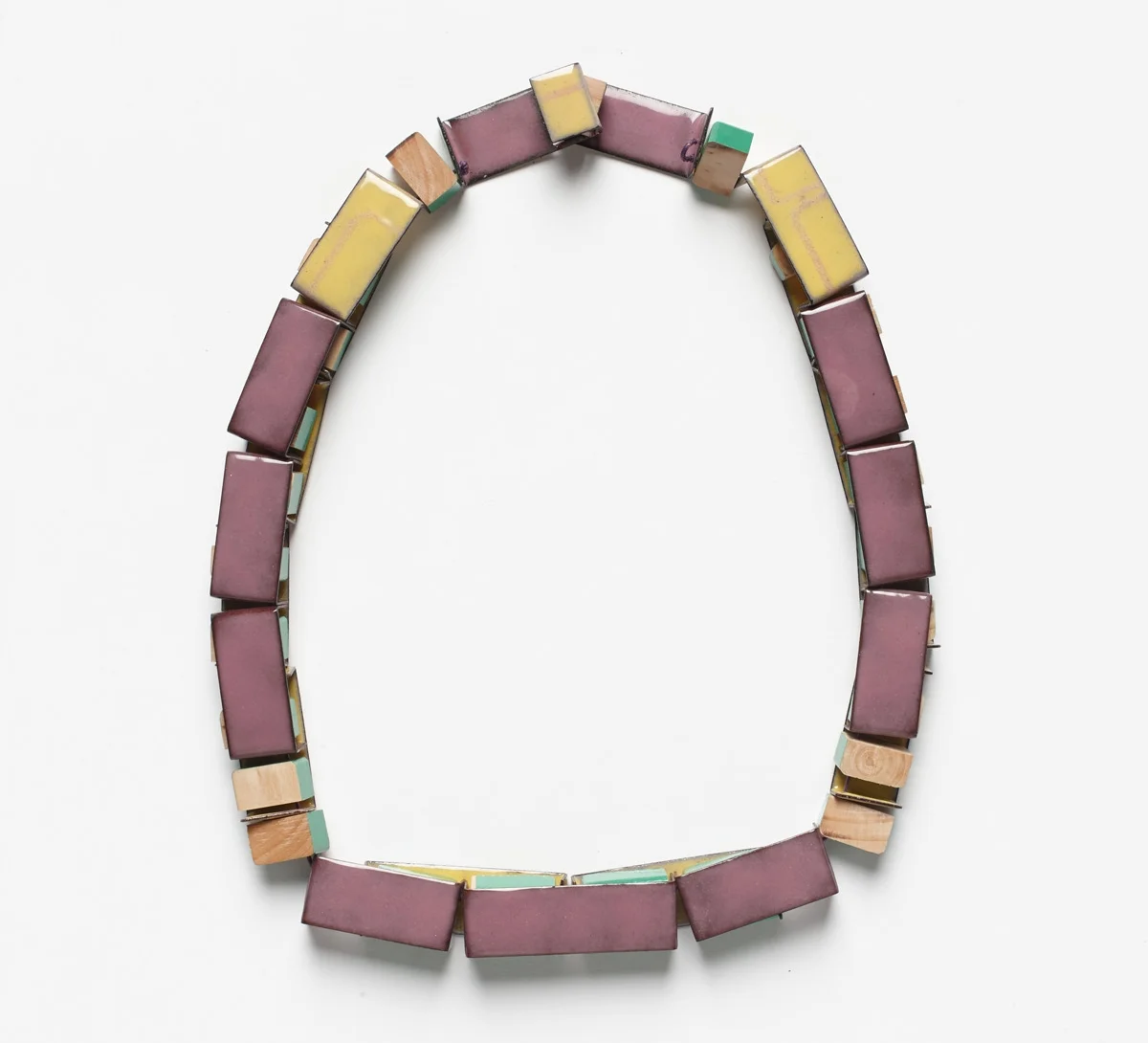 Interlocking Train , back view, 2013. Deconstructed wooden block toy, copper, enamel, thread. Photo by Jeremy Dillon.