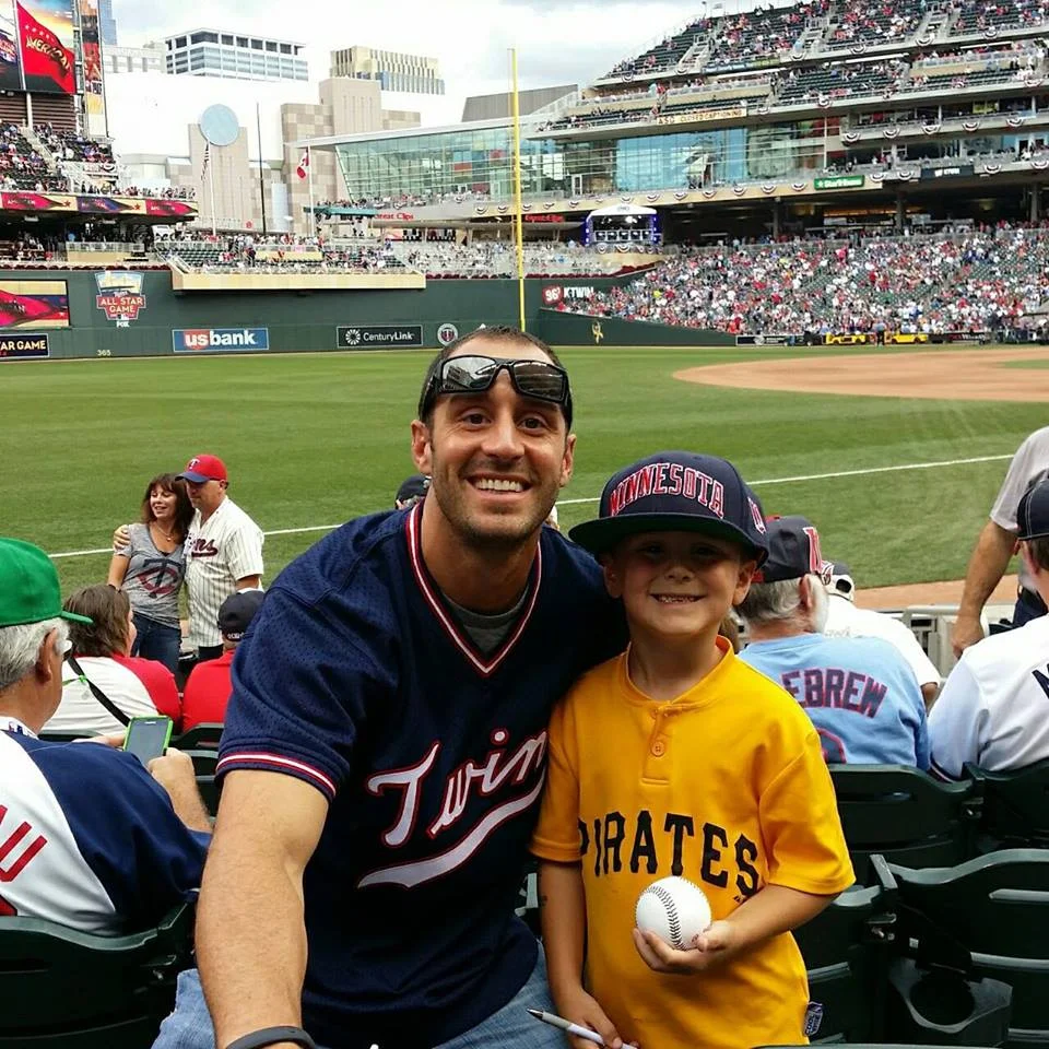 Crave's Founder Jason attending the 2014 All-Star Game at Target Field with his son Garrett.