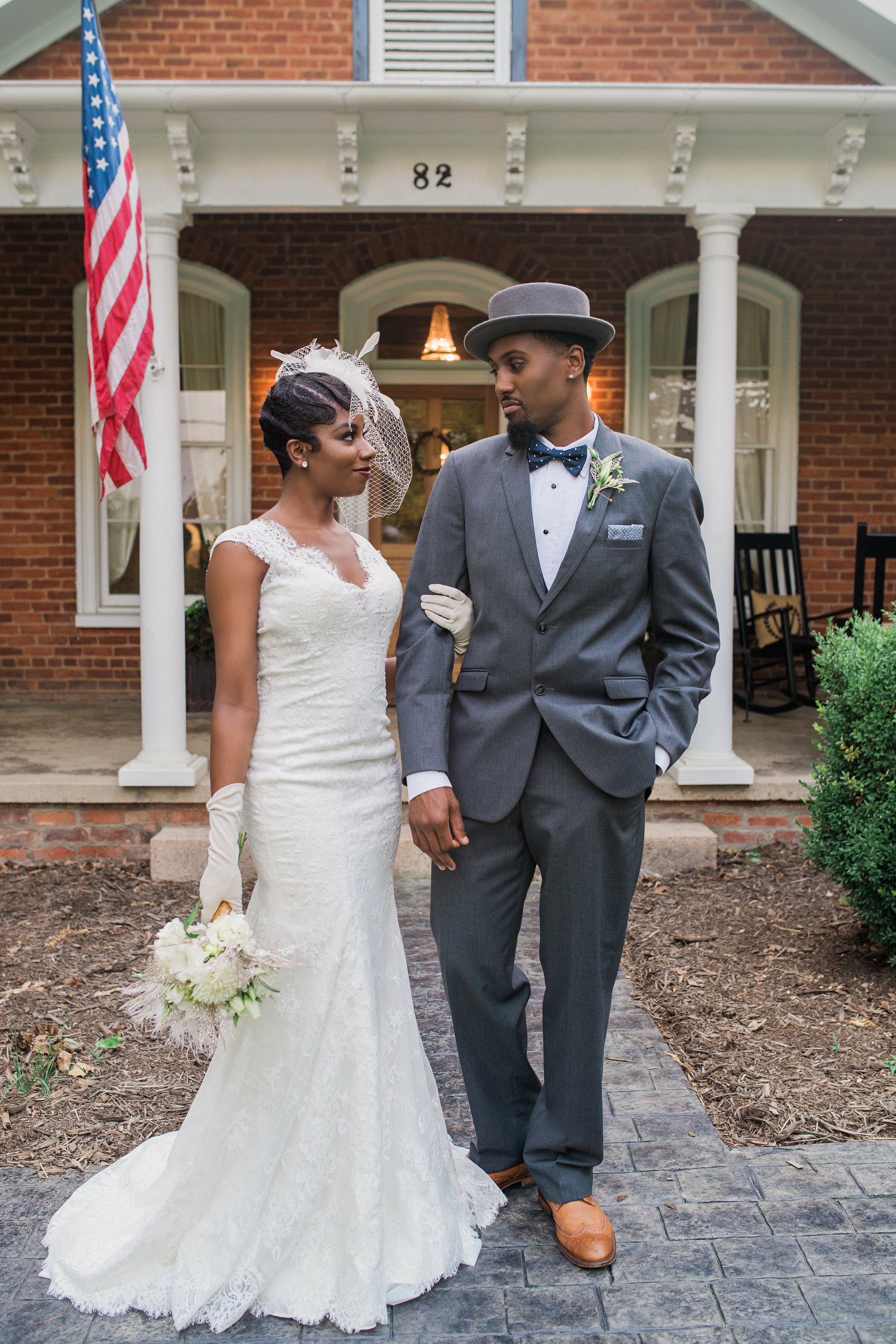 1-couple in front of home.jpg