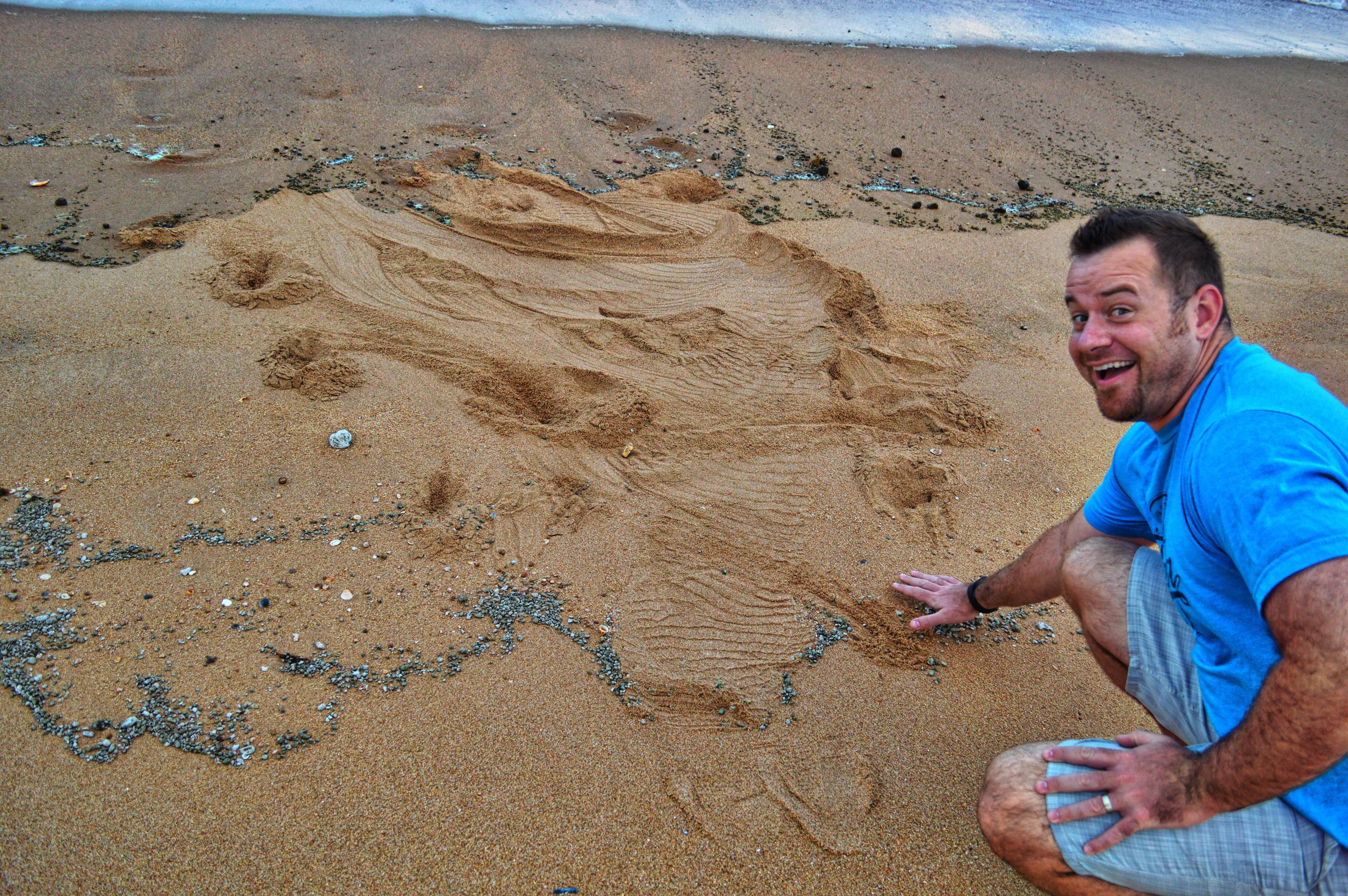 Dr. David Baker in Australia-the mark in the sand was from a giant crocodile 