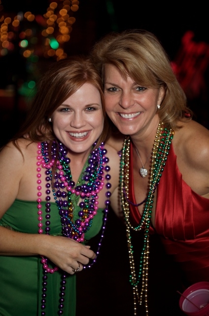 guests with beads at a Mardi Gras party Arden Photography