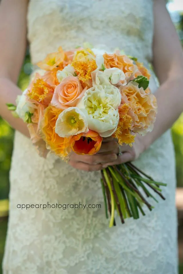Apricot, cream, peach, and coral are the big colors of the moment. They look strikingly beautiful against a cream or ivory gown. My sweet friend Jenna's wedding flowers were by my other precious friend Corey Hults of Corey Daniels Design for the Sonnet House in Leeds, Alabama. Stunning. (Photo: AppearPhotography.com)