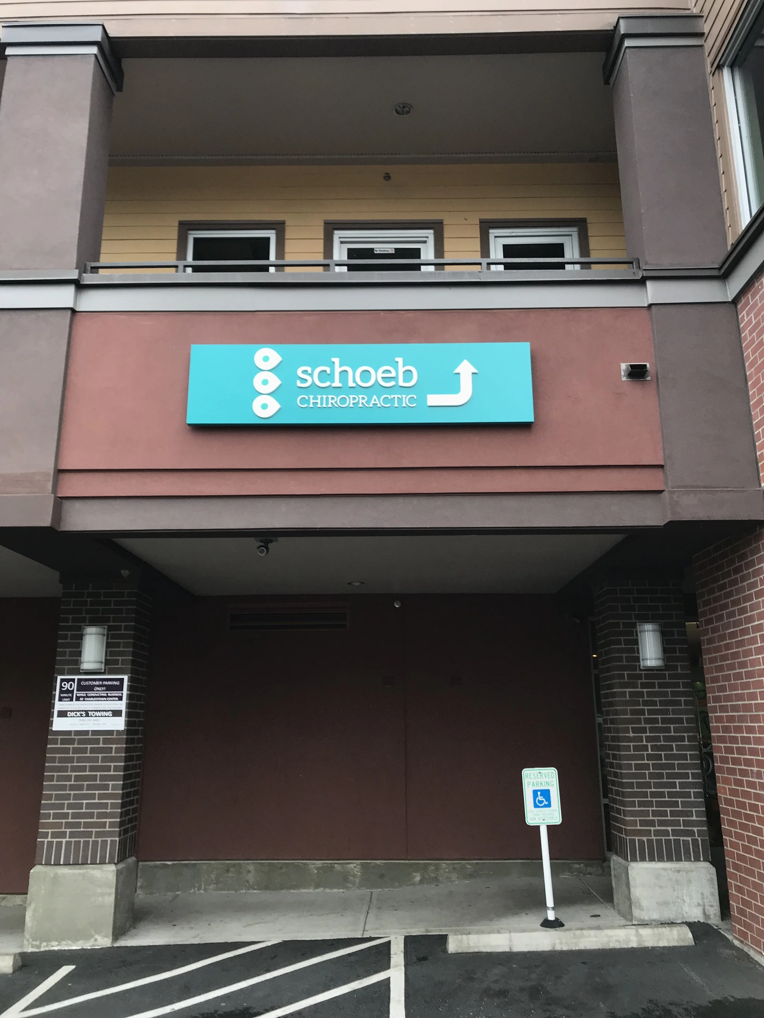 Signage from the off street parking behind the building. 2 stairways and an elevator help you up to the 2nd floor clinic entrance.