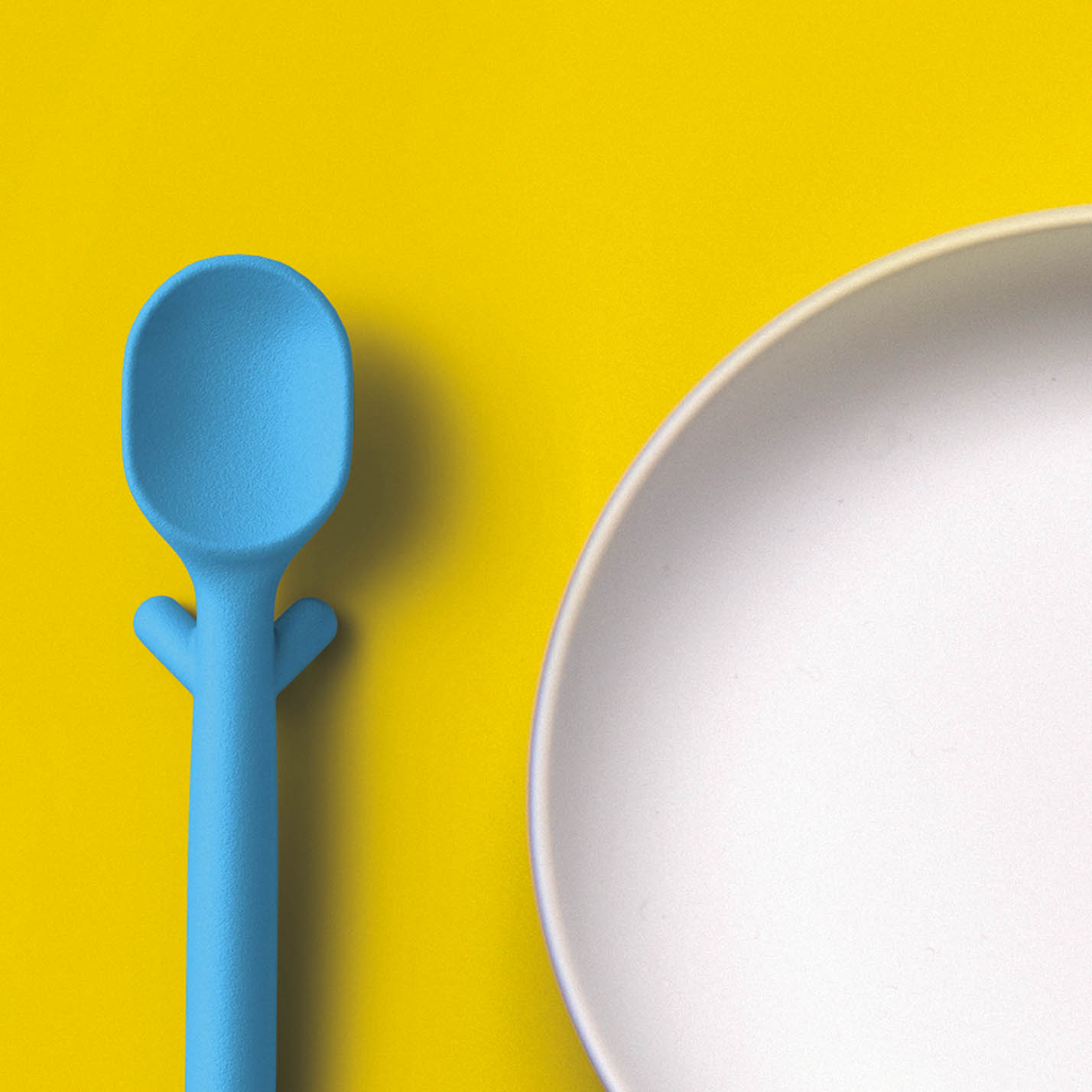 Nenu makes a very cool spoon with legs. Yes, legs. This not only keeps it elevated off dirty tabletops  but it helps elevate the spoon so little hands can pick it up.