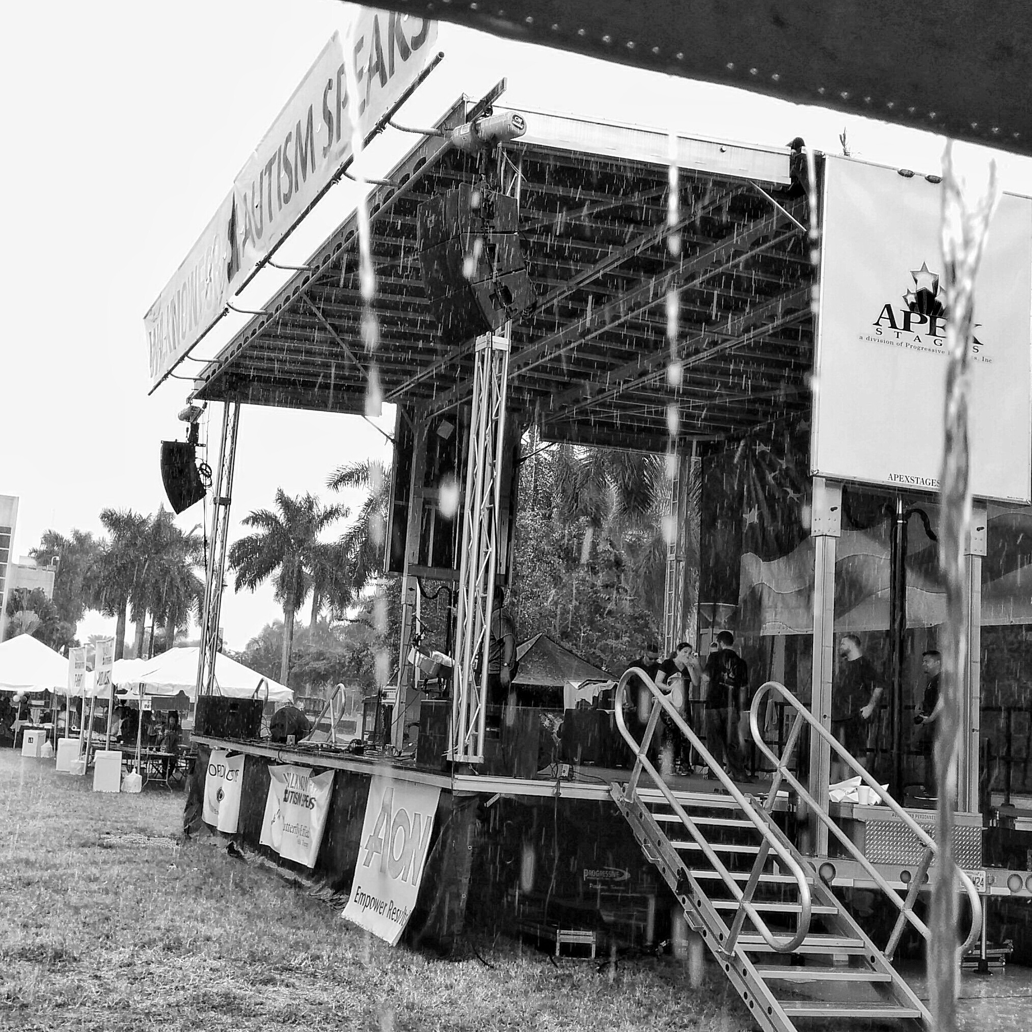 Taking shelter during a deluge this past Saturday at an Autism Speaks charity walk.
