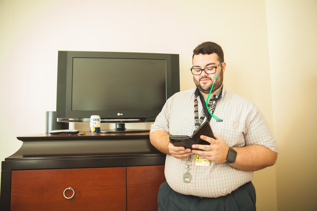 A man looks over the MagFest Schedule.