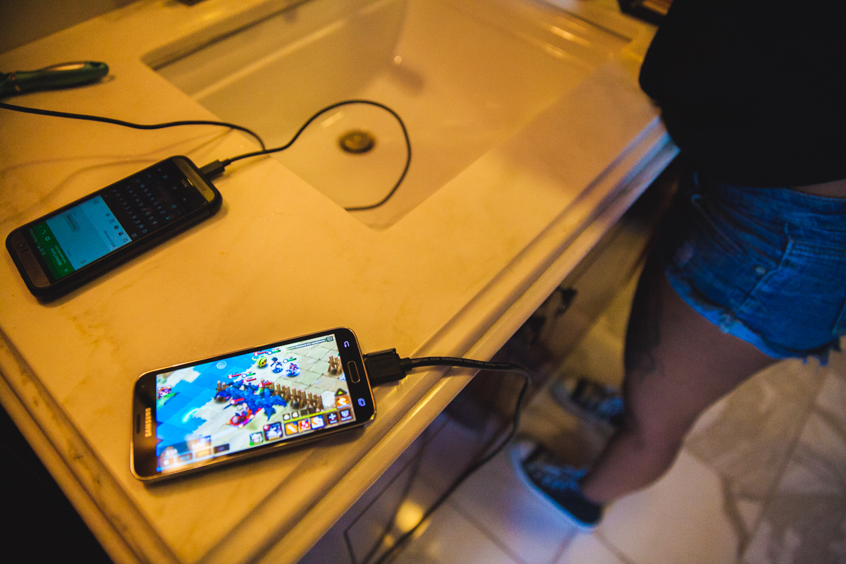 Gaming happens 24 hours at the convention. Even in the bathroom while getting ready.