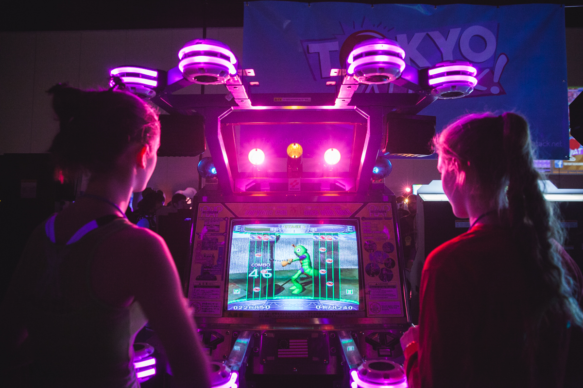 Two girls go head to head on a musical game.