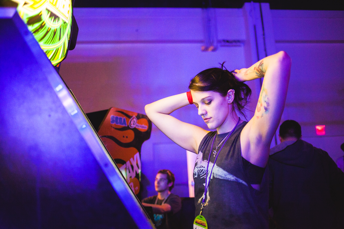 K centers herself before stepping on the Dance Dance Revolution pad. 